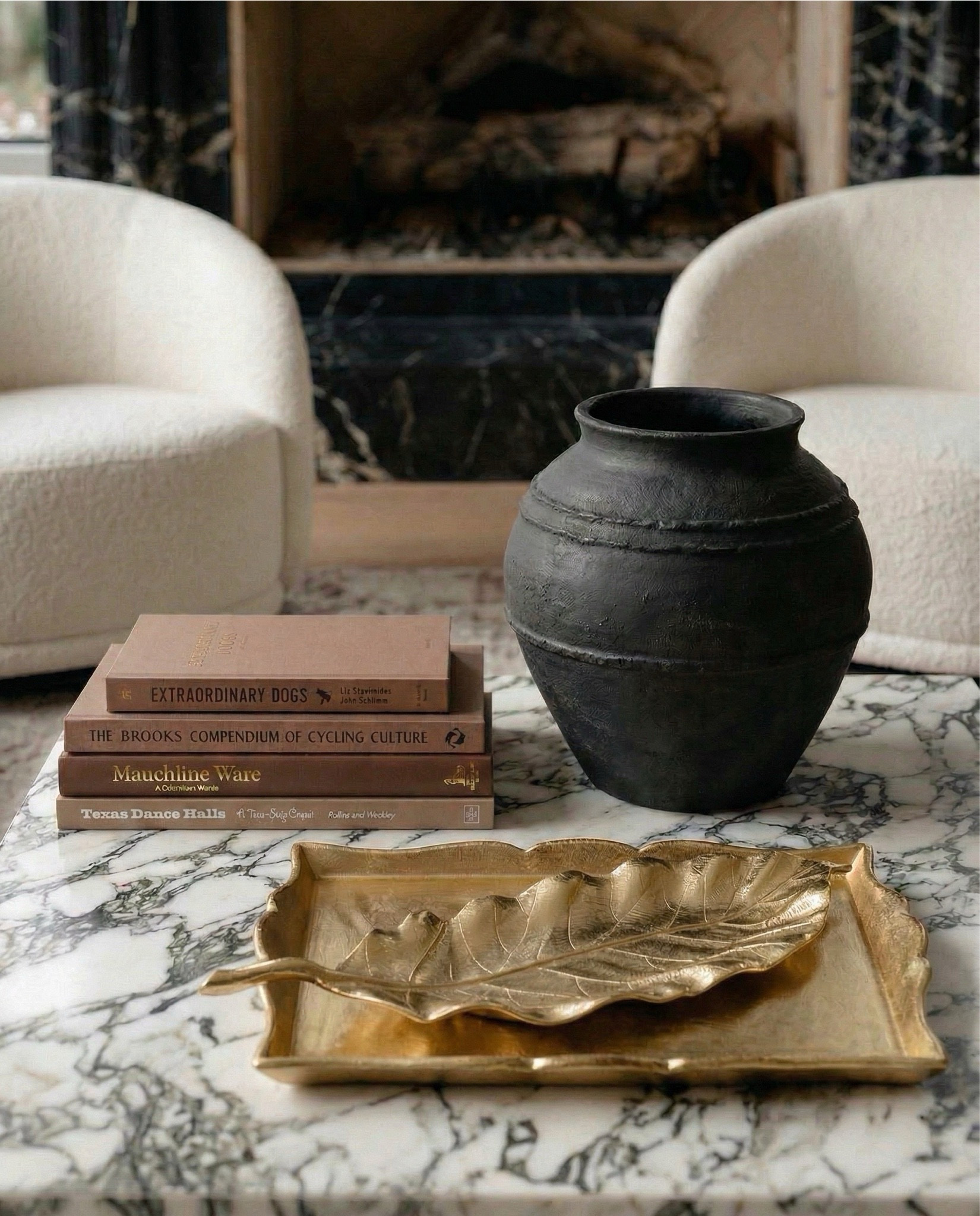 Shop the look
•Brown boucle sofa
•Marble coffee table
•Marble end table
•brass tray
•Black terracotta vase
•Brown decor books
•Brass leaf decor bowl 
•Brown vintage rug
•black and brown throw pillow
•brown knitted throw blanket
• white boucle swivel accent chair
•abstract wall art

#LTKHome #LTKSaleAlert