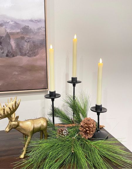 Christmas touches in the dining room. 

Battery operated candles, candle stick holders, pine branch, gold moose, abstract art

#LTKSeasonal #LTKHoliday #LTKhome