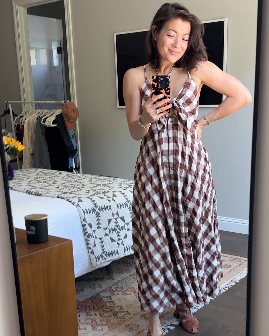 Ok finally giving this dress its own shoutout because I wore it this weekend for a BBQ/bday party and it was perfect in every way. The fit is SUPER customizable-  the buttons are functional, so you can adjust the slit, if desired, the bust actually ties, and the straps are adjustable. 

The cotton is so soft and I'm loving the brown gingham, too, since I'll be able to stretch it into fall, probably with western boots and a fisherman sweater. All around excellent purchase that's going to be a big part of my summer wardrobe.
