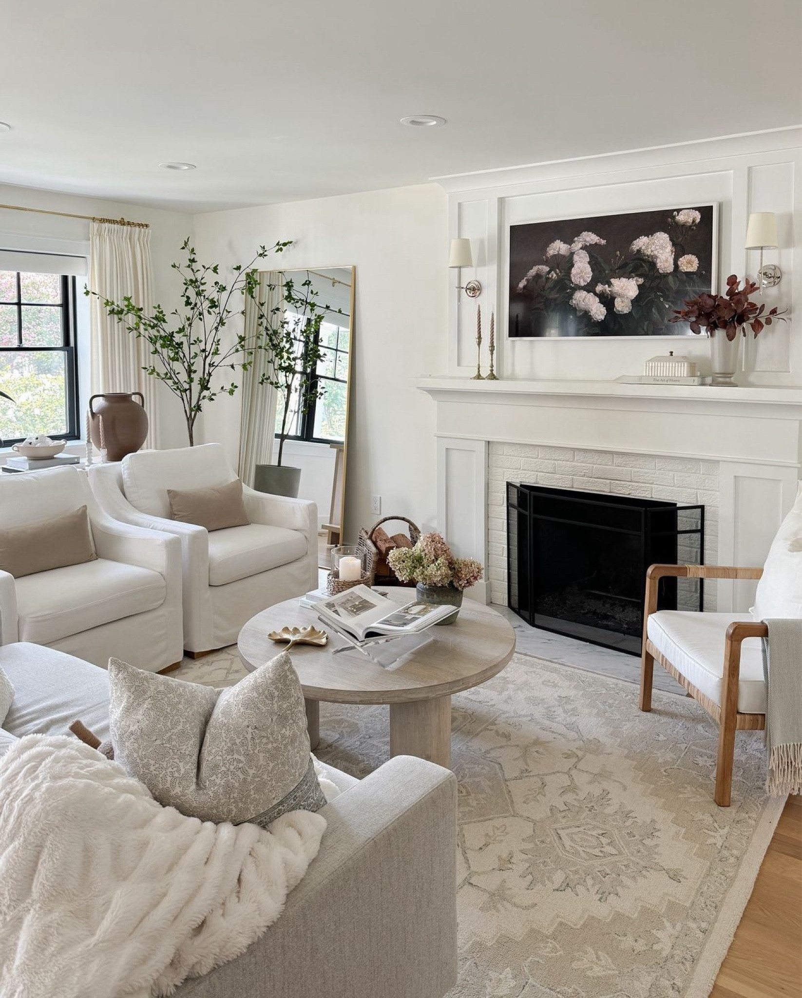 Living room, family room, gray modern sofa, white slipcovered slope arm upholstered accent chairs, traditional design, gallery frames, Studio McGee, McGee & co, upholstered chairs, affordable finds, tjmaxx finds, marshalls find, look for less, dining room, high end look for less, serene, calm, family friendly, Benjamin Moore Simply White paint, ivory and beige area rug, neutral rug, blue block print pillows, living room rug ideas, transitional design, traditional home, high end look for less, affordable finds, round coffee table, white washed coffee table, light wood coffee table, modern coastal design, brass floor mirror, standing mirror, faux plant, amazon faux tree, classic living room design

Curtain Details:
TWOPAGES Isabella Custom Curtains
Color: Off White/Creamy White 7084-5
Hanging Header Style: Triple Pleat
Width: 75" wide
Length (Height): 90” long
Lining: Room Darkening Liner, 140GSM
Body Memory Shaped: Yes
Hardware Details:
Finish: Brass
Diameter: 0.75”
Rings: 0.75” (1 1/2” diameter)


#LTKStyleTip #LTKSaleAlert #LTKHome