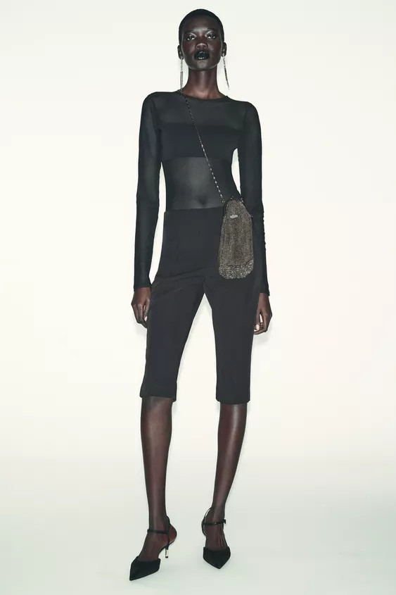 Semi-sheer round neck long sleeve bodysuit. Tonal combination fabric detail. Bottom snap button c... | Zara US