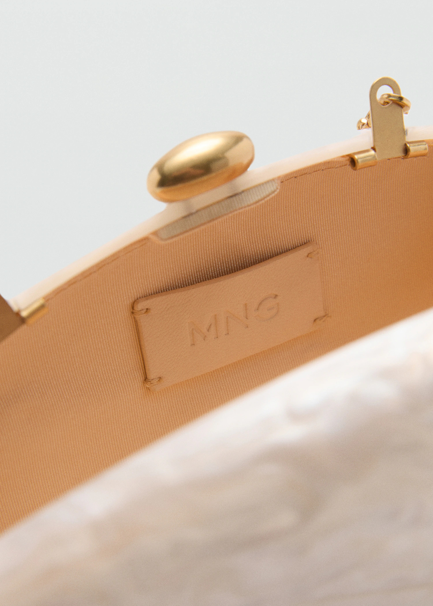 Pearl-effect clutch bag | MANGO (US)