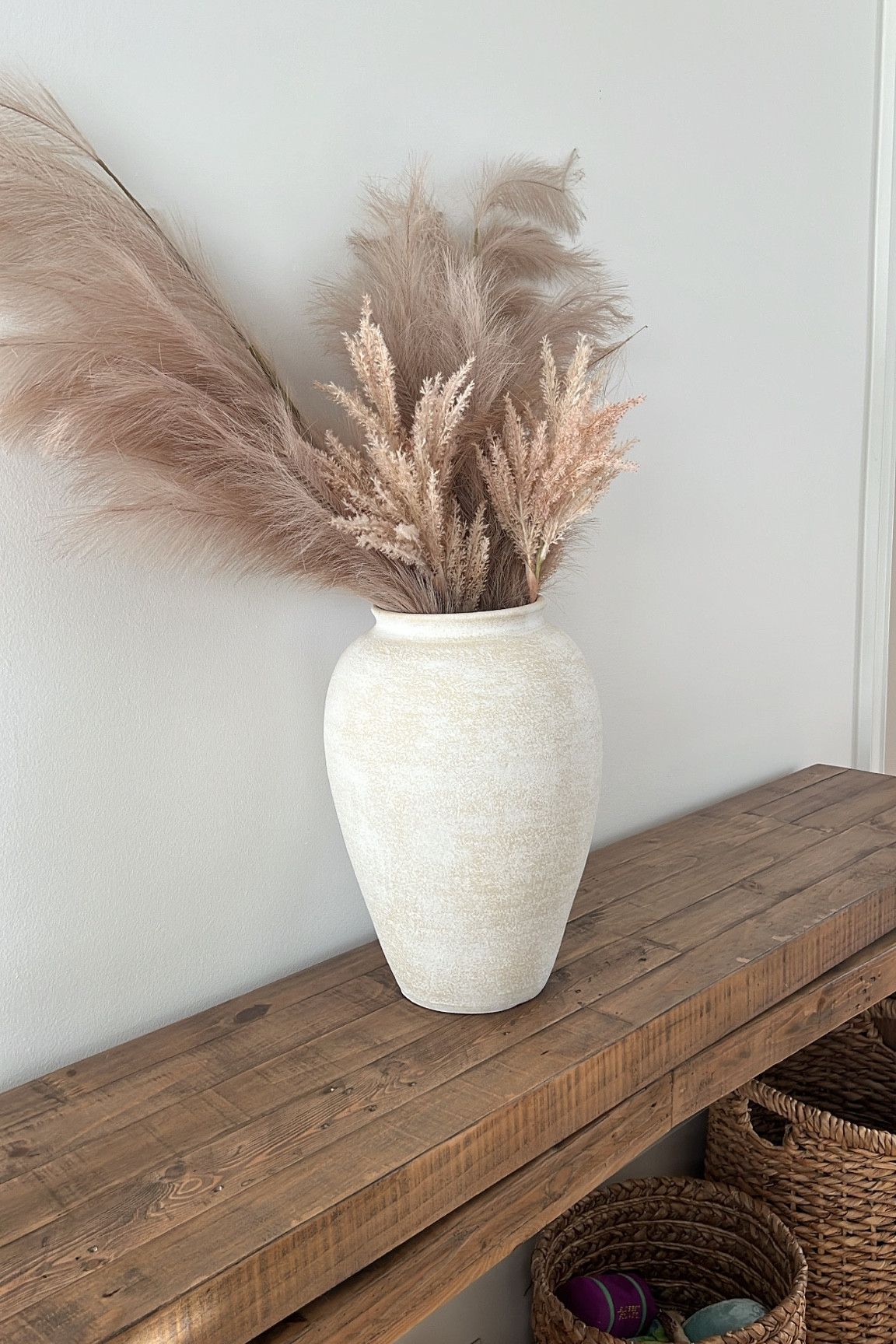 home decor
Large vase
Console table
Wicker basket 
Faux florals 

#LTKhome #LTKSeasonal