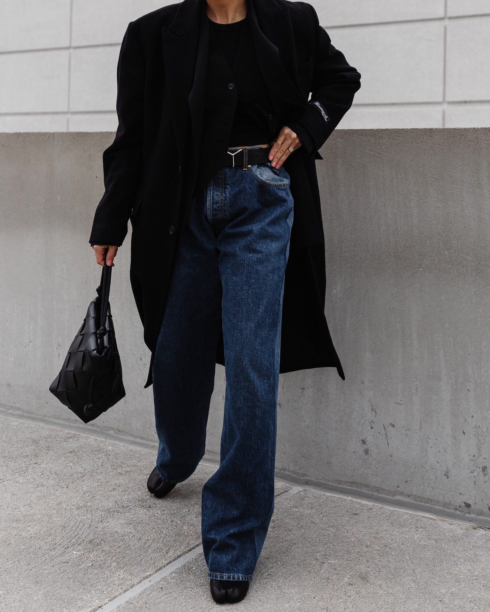 Maison Margiela oversized two-tone oversize jeans, (on sale here). Runs bug. I got a 38IT  Worn with The Frankie Shop vest, HommeGirls black wool coat, Maison Margiela Tabi Heels, Y/Project Belt, and Bottega Veneta bucket bag.

#LTKSale #LTKsalealert #LTKFind