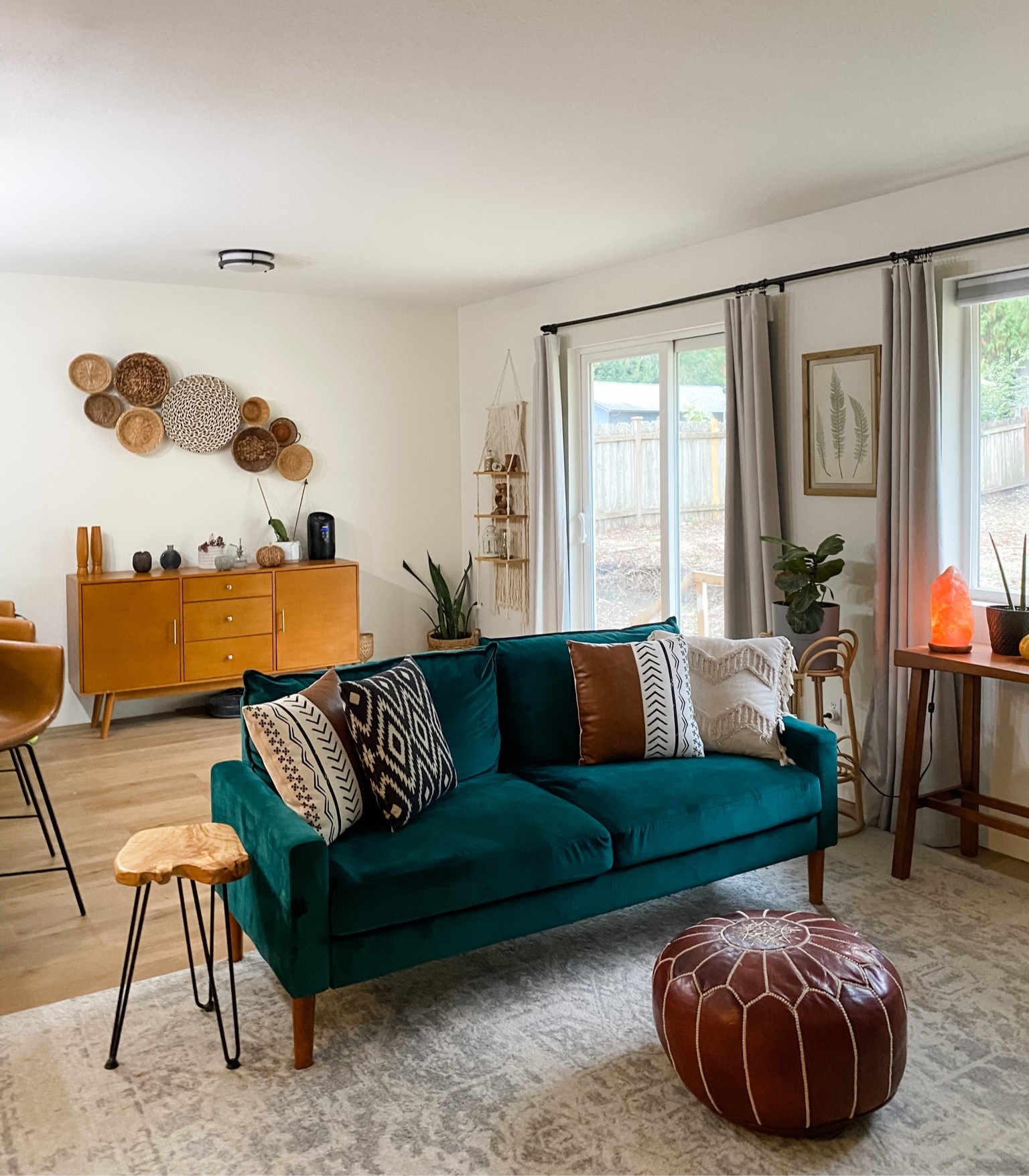 The gathering space. This living area off the kitchen and dinning room was one of the most difficult to work with but dividing the space between the kitchen bartop and the living room made the most sense. The couch acts as a room divider and focal point. Decorating this room on a budget was a breeze! Most of the decor items were under $100 and gathered over time  

#LTKstyletip #LTKunder100 #LTKhome