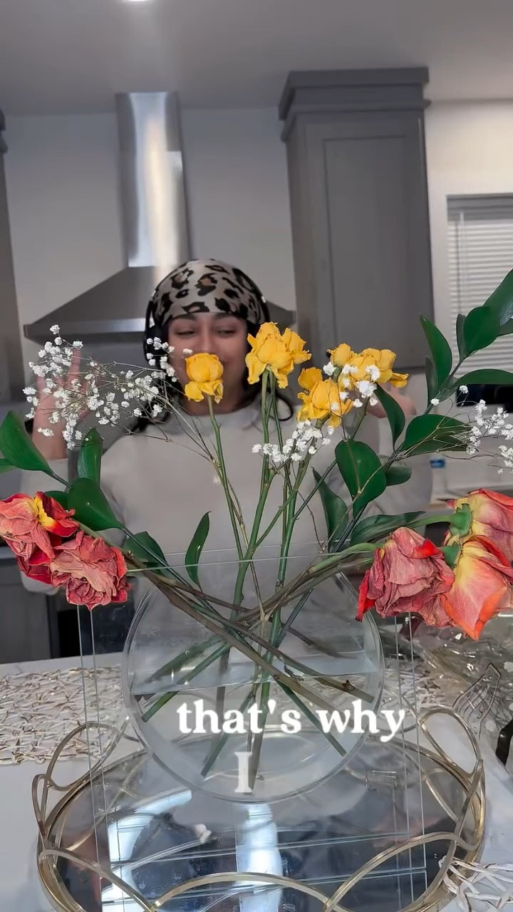 I’ve learned that when the energy shifts, the room should too.

So I reset my flowers — not because they’re “pretty,” but because they hold memories, moods, conversations… and sometimes that energy has done its job.

Fresh stems.
Ice to slow the aging.
A tiny cap of bleach so nothing toxic spreads.

It’s symbolic and practical.

Clearing the vase feels like clearing my mind.
Arranging the flowers feels like choosing softness on purpose.
And my nervous system always feels it first.

This isn’t decor to me, it’s energetic hygiene, ritual, and self-regulation in one. 🤍




#LTKmomlife #LTKHome #LTKselfcare
