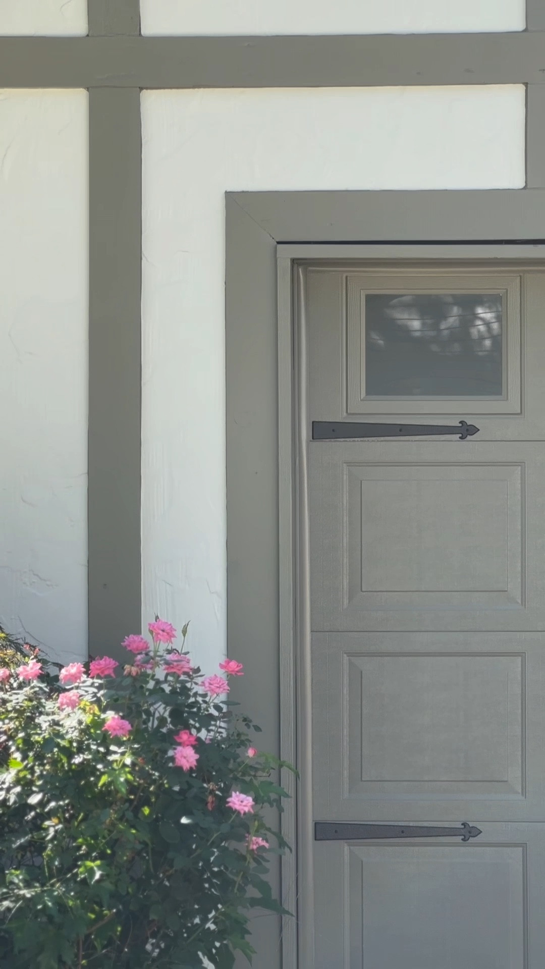 Garage door makeover with paint, new lighting, and carriage door hardware 🤎

#LTKHome