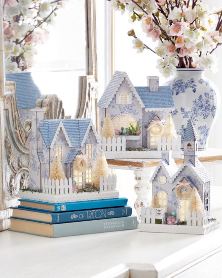 These blue floral paper houses light up with a pink glow through the windows.  They have so many perfect touches from the clear glitter, to the picket fence around the yard, to the trees, the wreath, and the cute little window boxes with spring flowers.  Would make a perfect hostess, birthday, or Mother’s Day gift.  

#LTKSeasonal #LTKstyletip #LTKhome