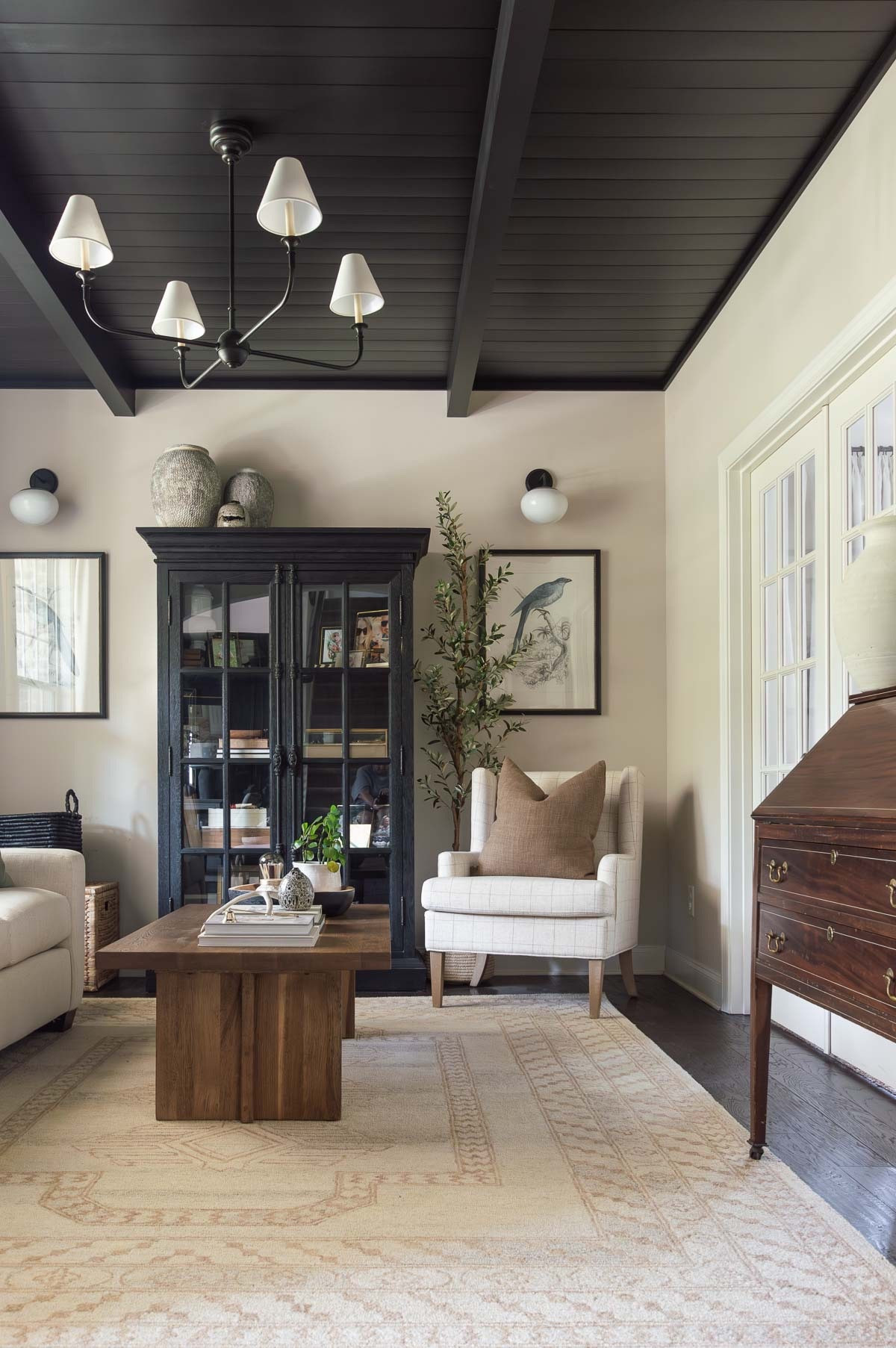 My conversation room feels like fall 95% of the time, just by the colors and wood tones. I still swapped in a few darker pieces for the season. home decor fall decor living room decor neutral decor area rug iron chandelier arm chair bird print curio cabinet styling

#LTKStyleTip 

#LTKHome #LTKSeasonal