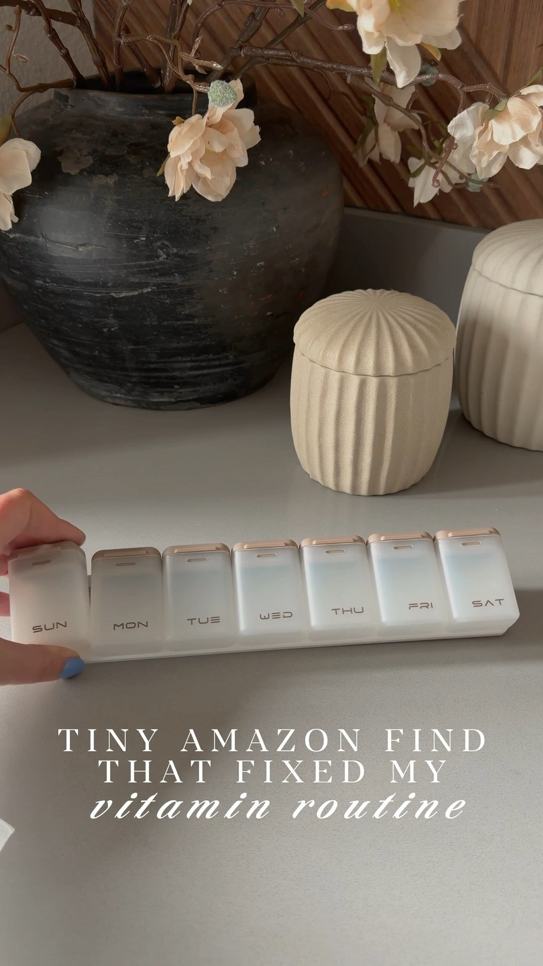 I know it’s sounds silly but this little gadget is truly helping me stay on track with one of my health goals for 2026…consistently take my vitamins and supplements! This little pill organizer from Amazon is obviously very aesthetically pleasing, 😍 but more than that, it’s actually super functional. You can keep on your nightstand or vanity using the little feet on the stand, or you can hang it on the fridge or another prominent location so you always remember to take your vitamins/medications! Each day also has a magnet and can easily removed from the base so you can throw it in your purse or work bag if you need to take them on the go! It even comes with a carrying case so you can take it with you when you travel! Perfect for everyday but also a great little travel find!  

#LTKHome #LTKmorningroutine #LTKselfcare