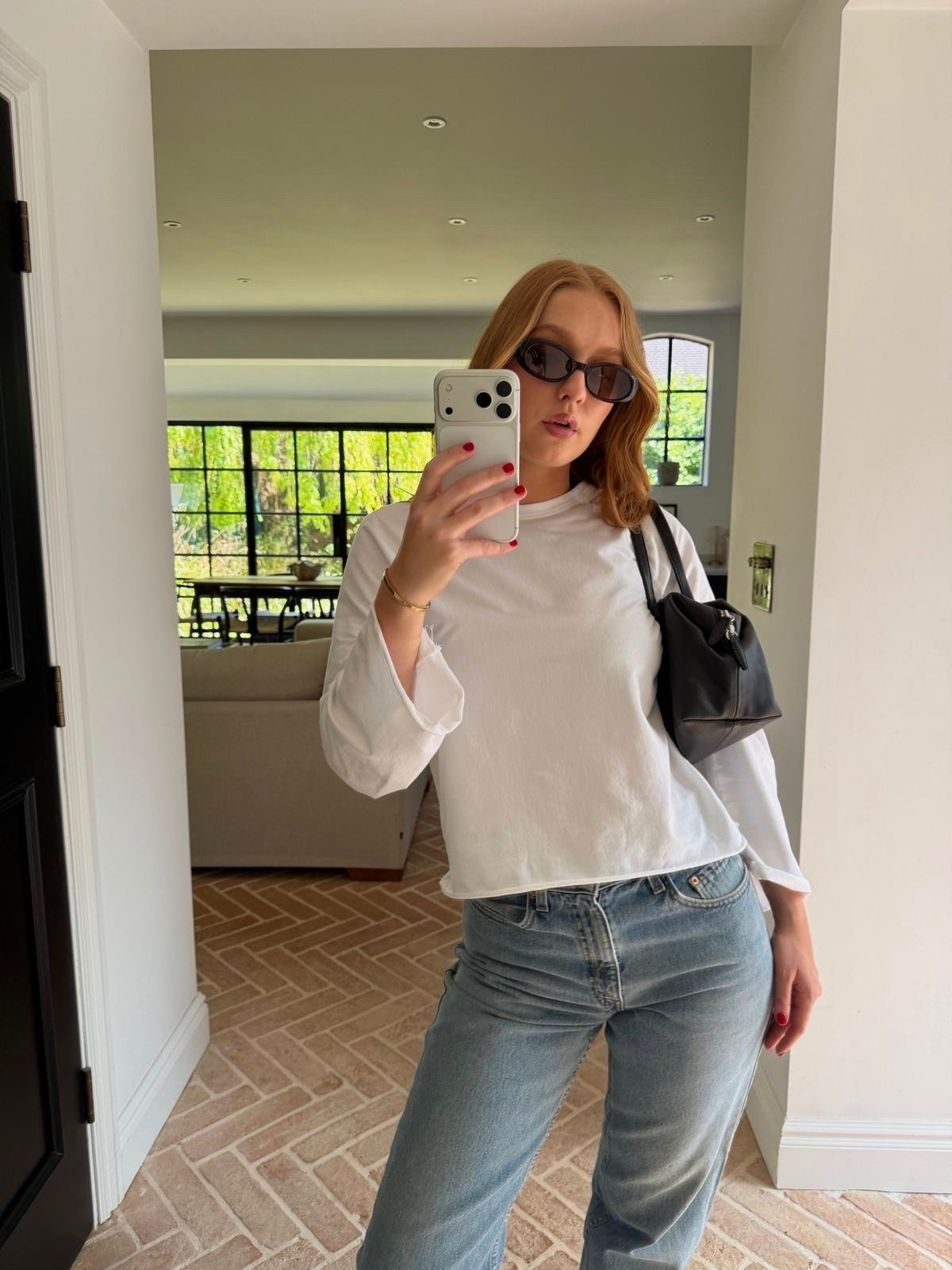white oversized tee, white longline tee, relaxed fit white top, boxy white tshirt, mid wash barrel jeans, straight leg jeans, relaxed jeans, wide leg jeans, mid blue denim, black flip flops, leather thong sandals, flatform flip flops, black thong sandals, black mini bag, croc effect shoulder bag, black structured bag, mini top handle bag, black cat eye sunglasses, black rectangle sunglasses, small black sunglasses, street style outfit, NY street style, minimal casual outfit, effortless summer outfit, off duty model look, quiet luxury casual, summer basics outfit, everyday casual look

#LTKjeans #LTKspring #LTKdatenight