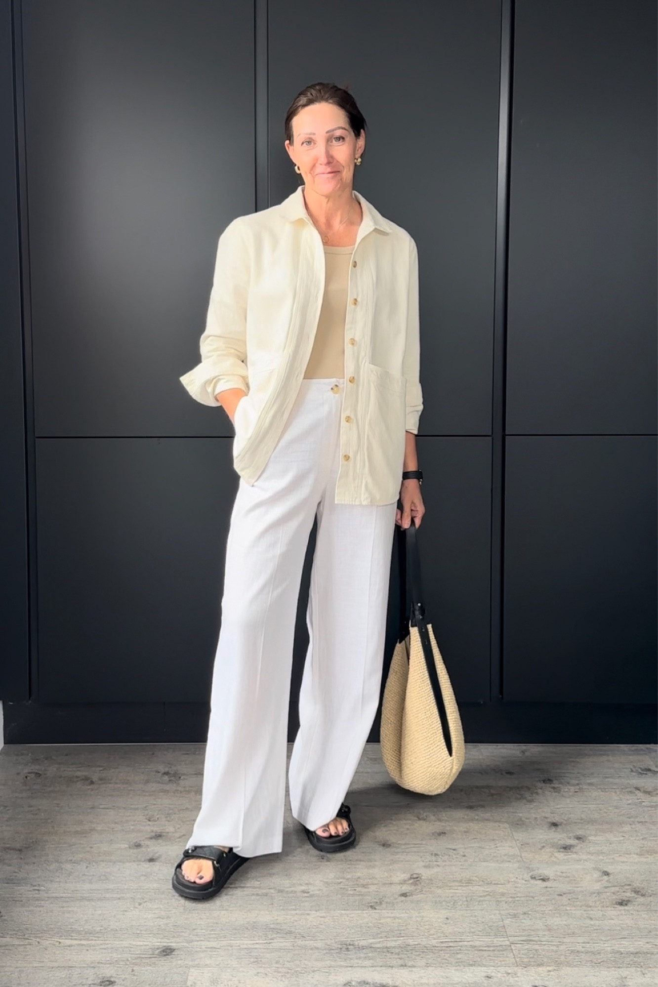 White wide leg linen trousers with a beige vest, cream shacket and dad sandals x