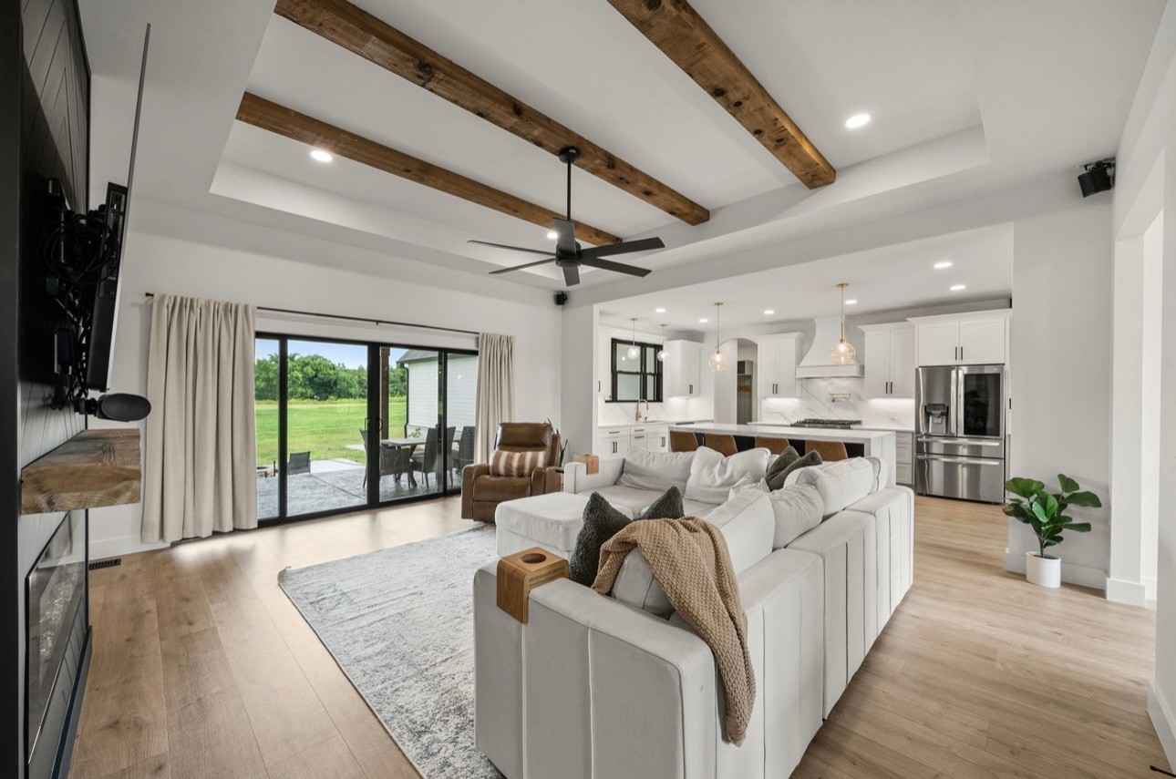 Open concept boho living room & kitchen 🤍🌿

#LTKFamily #LTKHome #LTKStyleTip