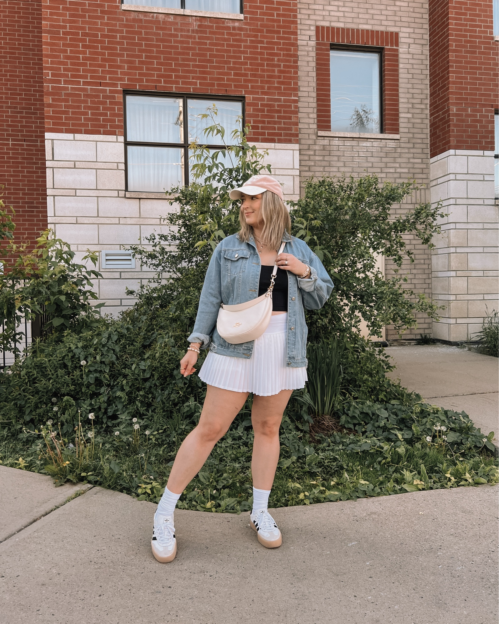 Casual midsize spring to summer outfit - white tennis skirt (linked similar), my fave Amazon denim jacket, black tank, adidas sambas, coach crescent bag

#LTKspring #LTKmidsize #LTKsummer