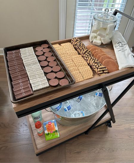 EASY SUMMER HOSTING IDEA: s’mores night! I love loading up this rolling cart with alllll the s’mores fixin’s. I added some ice packs under the sheet pan of chocolate to make sure it didn’t melt. Such a fun and easy thing to host and invite people over for!

#LTKKids #LTKFamily #LTKSeasonal