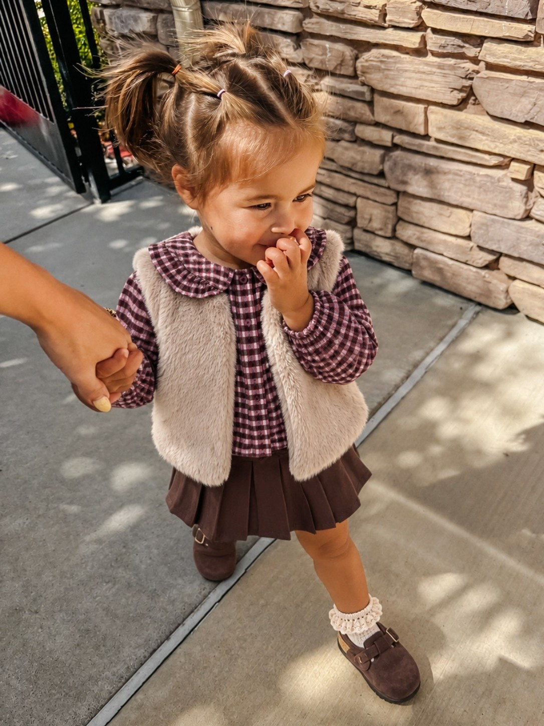 @Zara kids toddler girl plaid top, faux fur vest and brown skirt outfit.
Fall outfit
Gap clogs