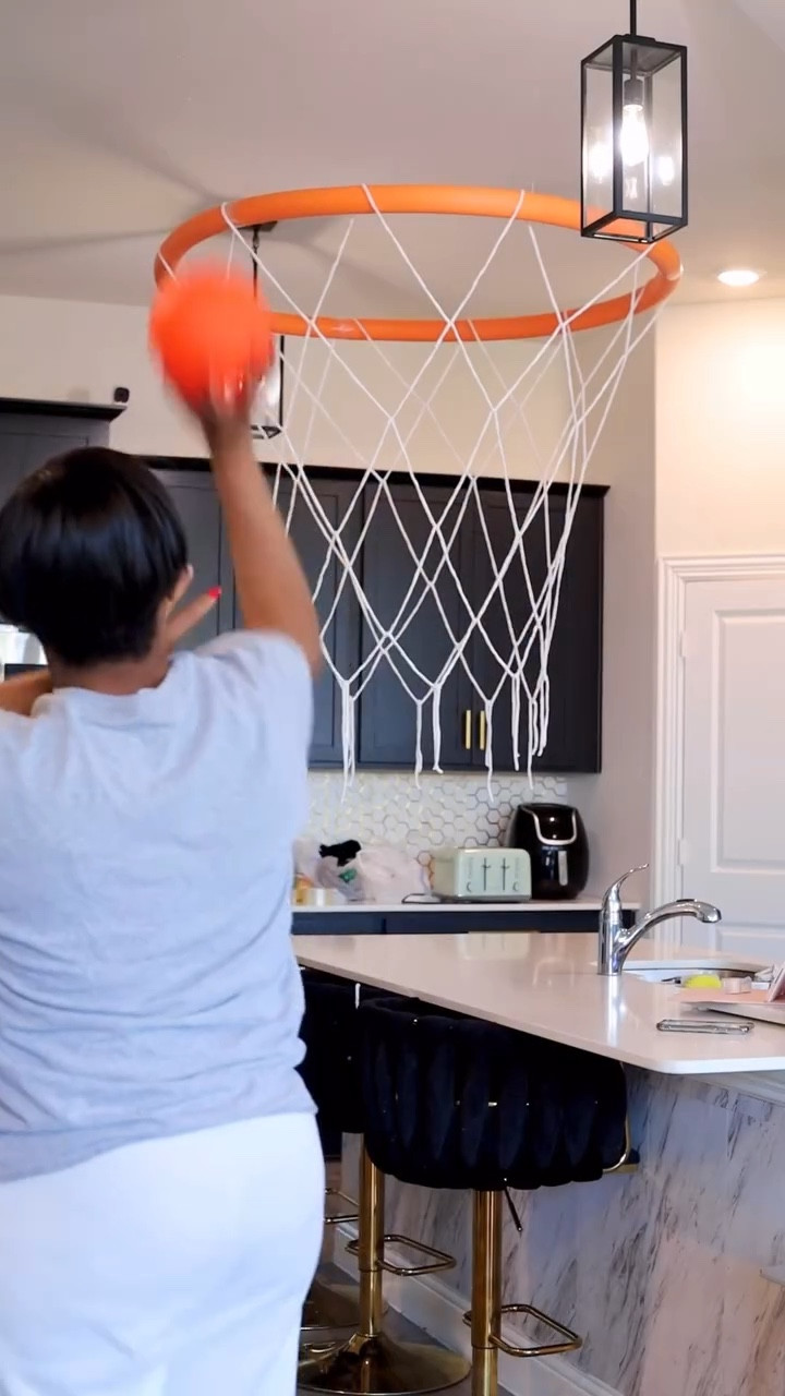 Basketball themed birthday 🏀✨

1. Taped three pool noodles together to form a ring.
2. Cut 11 pieces of string, all the same length.
3. Draped the strings evenly over the pool noodle ring.
4 Began tying the strings together to create the net pattern.

#basketball #sportsmom #diybasketball #sportlife #boymom #birthday