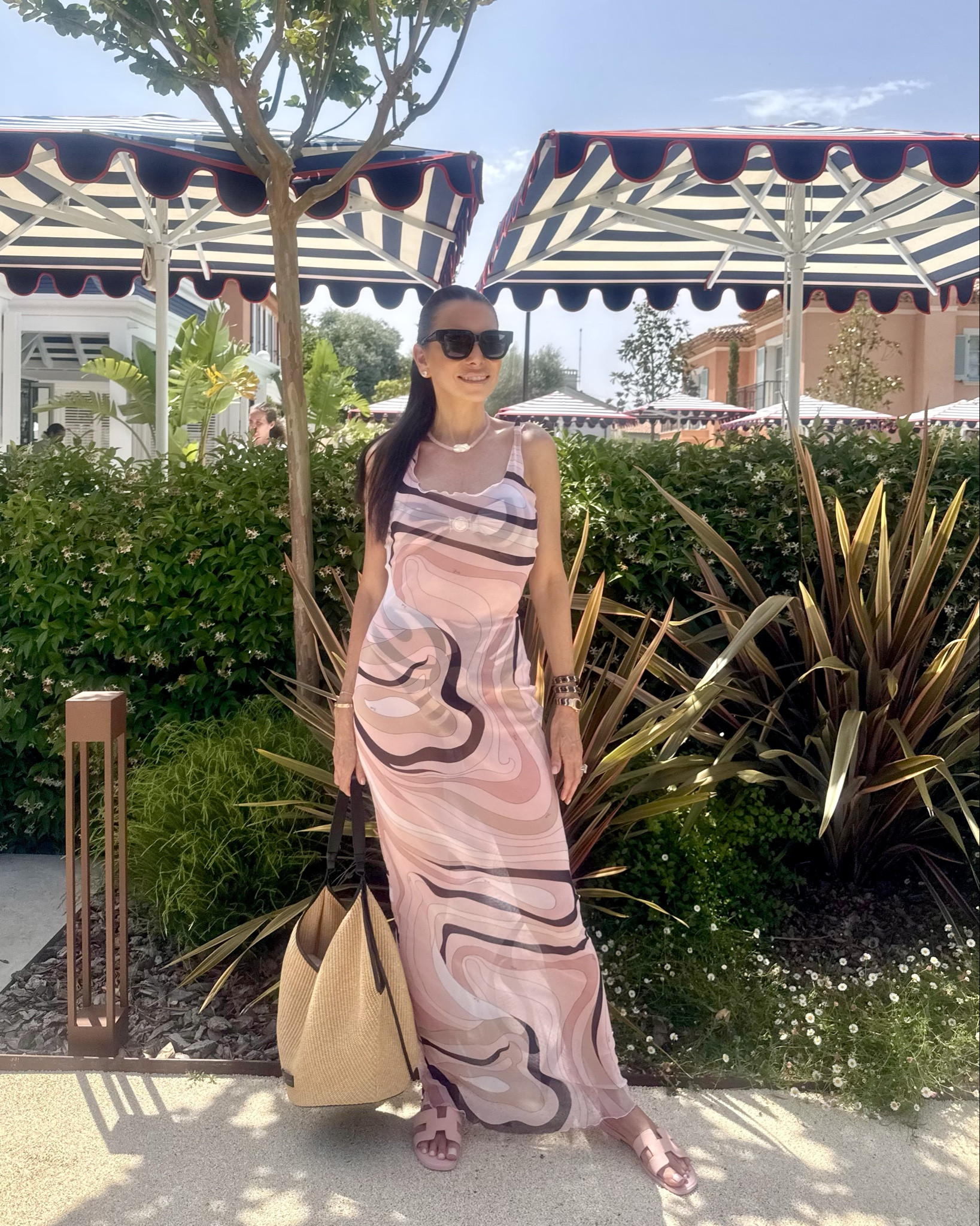 Poolside to lunch in one easy outfit 💗 Wearing a pink dress from Pucci’s latest collection, featuring this season’s Onde print—a fresh take on their iconic patterns. It’s bold in design but subtle in tone, with soft pink and black making it both striking and wearable.

Layered over the matching bikini top and high-waisted bottoms for a coordinated, elevated resort look. Finished with Bottega sunglasses and a Figaro-style gold necklace (similar links below).

Prints in muted tones are a summer staple—they travel well, style easily, and never feel overdone. #LTKswim #LTKtravelstyle #PucciPrints #OndePrint #SummerChic #ResortStyle #LTKunderthesun #TanyaZuckerbrotStyle

#LTKTravel #LTKOver40 #LTKSwim