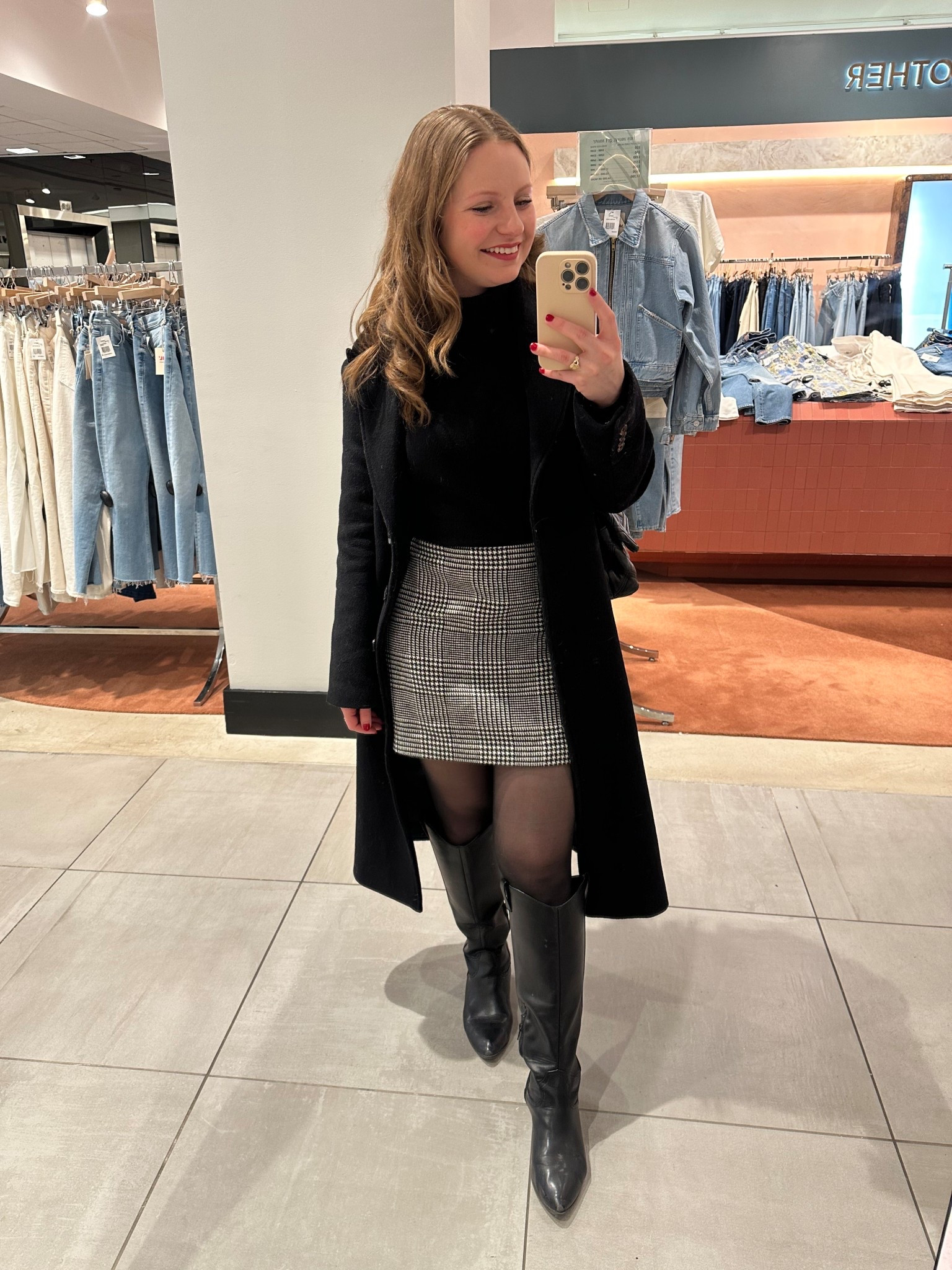 Loved wearing this classy black and white look! The Abercrombie coat runs TTS to roomy— wearing an XS.

Black overcoat, black turtleneck, black and white check skirt, black riding boots 

#LTKWorkwear