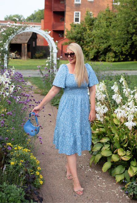 Early fall garden walk before all the blooms fade. This blue floral smocked midi dress is great for warmer fall days. Pair with a cardigan and booties and it will take you right into the cooler months.

#LTKmidsize #LTKSeasonal #LTKover40