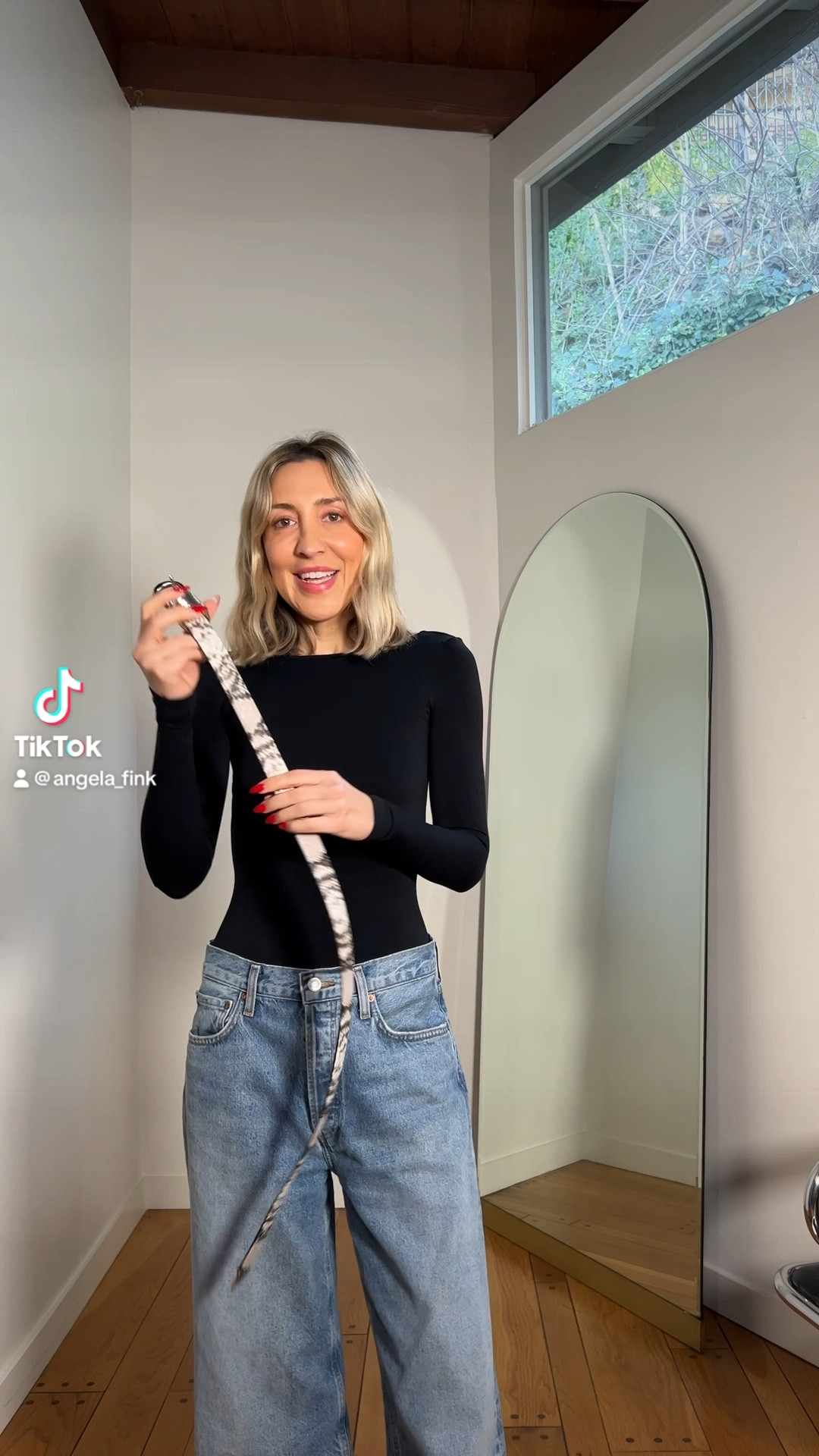 Styling out a snakeskin belt. 

#LTKstyletip