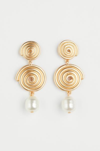 Large earrings with two spiral-shaped metal discs in different sizes and a plastic bead pendant. | H&M (US + CA)