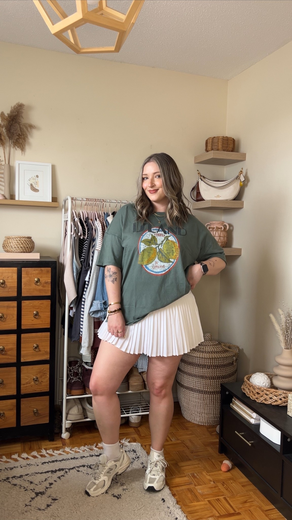 Casual spring to summer outfit on sale! Wearing my usual size L in the graphic tee. Wearing M in the white tennis skirt, I bought it years ago & if I was ordering now I’d get L although M still fits. New Balance sneakers run a little big, I’m a 9.5-10 and wear a 9

#LTKsale #LTKmidsize #LTKsummer