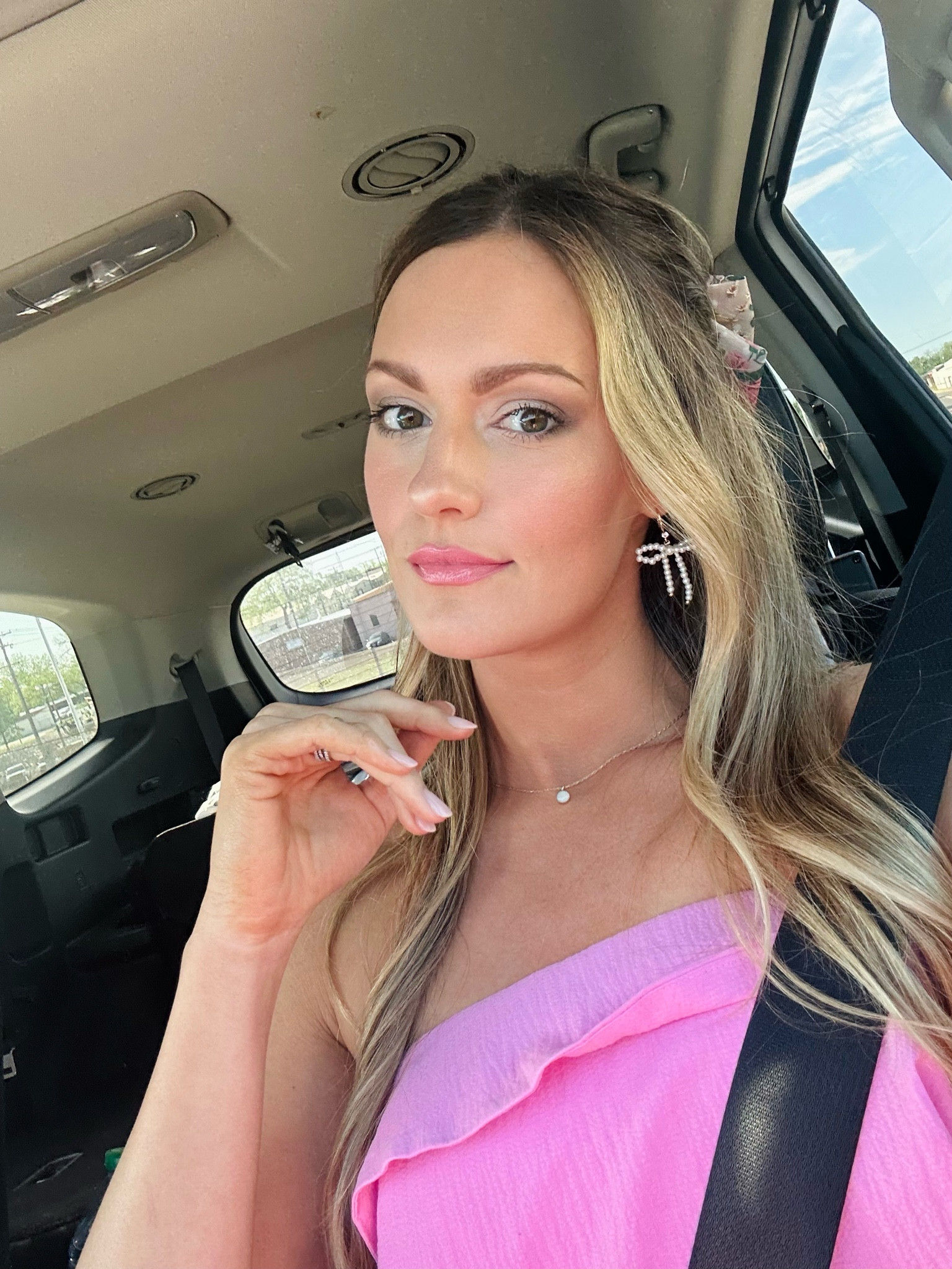 spring outdoor wedding guest outfit details. Bow earrings. Hair bow. Petal & Pup Jumpsuit wearing size small. 