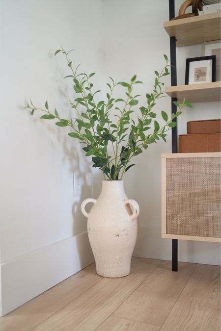 Beautiful 40” faux green leaf stems from Walmart - perfect for a large vase! I am using 4 stems here  This vase was found at TJMaxx. 

#LTKhome #LTKfindsunder50 #LTKstyletip