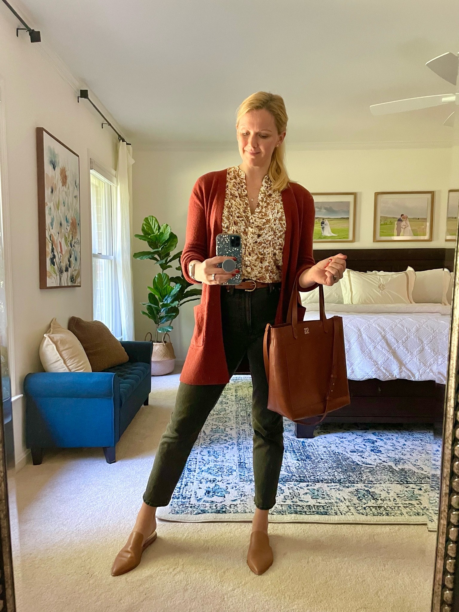 Today’s outfit of the day for a casual work day 

Long, soft burgundy cardigan & short sleeve floral blouse with functional buttons.

High waisted faded black straight leg jeans.

Wearing my normal size in everything. 

Jeans plus the Brown leather, mules, belt and tote are part of a sale — 25% off $100+ and 30% off $200+

#LTKitbag #LTKsalealert #LTKSeasonal