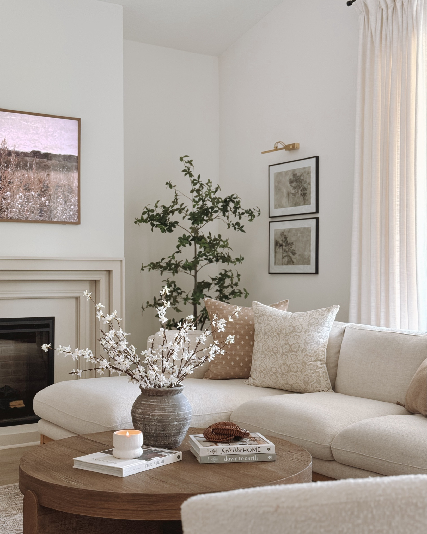 Can you spot all the changes in this space!? 👀

I’m trying a new layout and moved this bookshelf we’ve had for years to the side of the fireplace. We built a new fireplace surround and I also added a picture light above the two frames. Slowly but surely becoming the living room I’ve always dreamed of having. 🥰 

#LTKHome