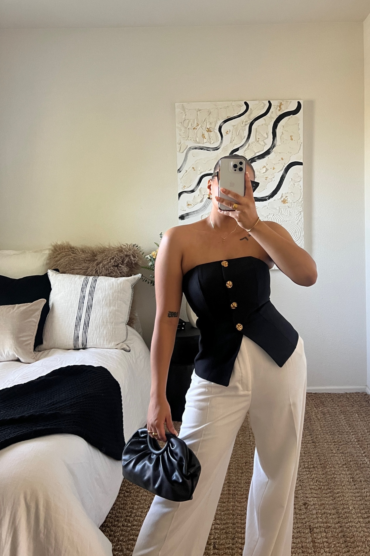 This sleek & classic tube top is such a statement piece. The gold buttons and split add some edge. I love balancing a fit with some wide leg pants, adds perfect drama. 

#LTKU #LTKstyletip #LTKparties