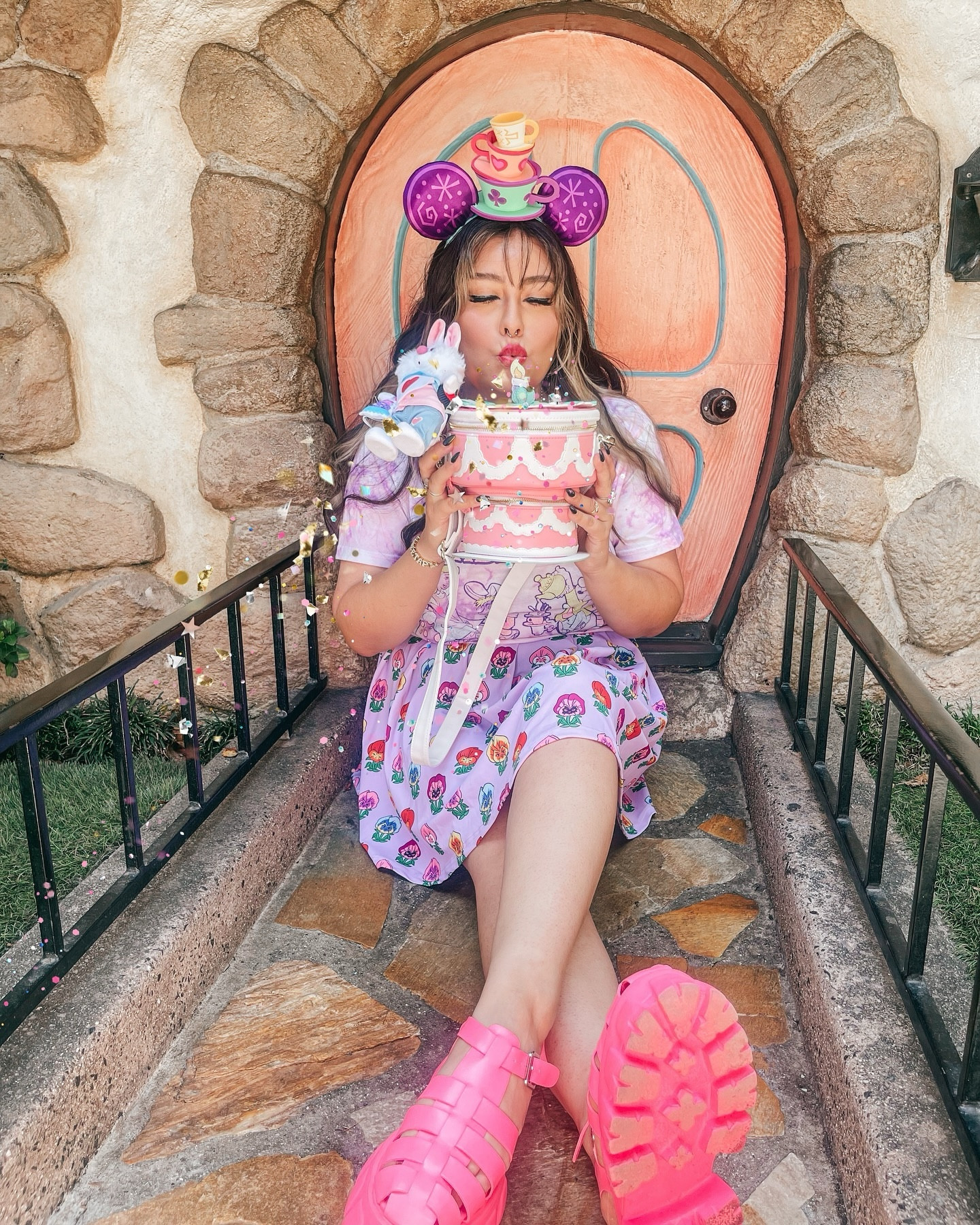 It’s not even my birthday, but he want to lick the icing off🎂🍰🎉😋🫖✨ a very merry Unbirthday to youuu! as soon as I saw this Alice in Wonderland cake @loungefly I knew I had to snag it and style it. I love the whole birthday cake, icing sprinkles, celebration vibes. 
Being alive and healthy, with the opportunity to wake up and have the freedom to do what our heart desires, is the biggest blessing! So here is a post to celebrate life!🎉🫖
What is something you are celebrating or grateful for this week?

🍰🎂FIT DEETS🎂🍰
skirt @cakeworthy 
Shoes @stevemadden 
Ears @disneyparks borrowed from bff
shirt  @target @targetstyle 
Bag @loungefly @boxlunchgifts 
Necklace @fatallyfemininedesigns with an added diy @disneydoorables Alice charms by me
..
#aliceinwonderland #unbirthday #madteaparty #averymerryunbirthday #teacups #fantasyland