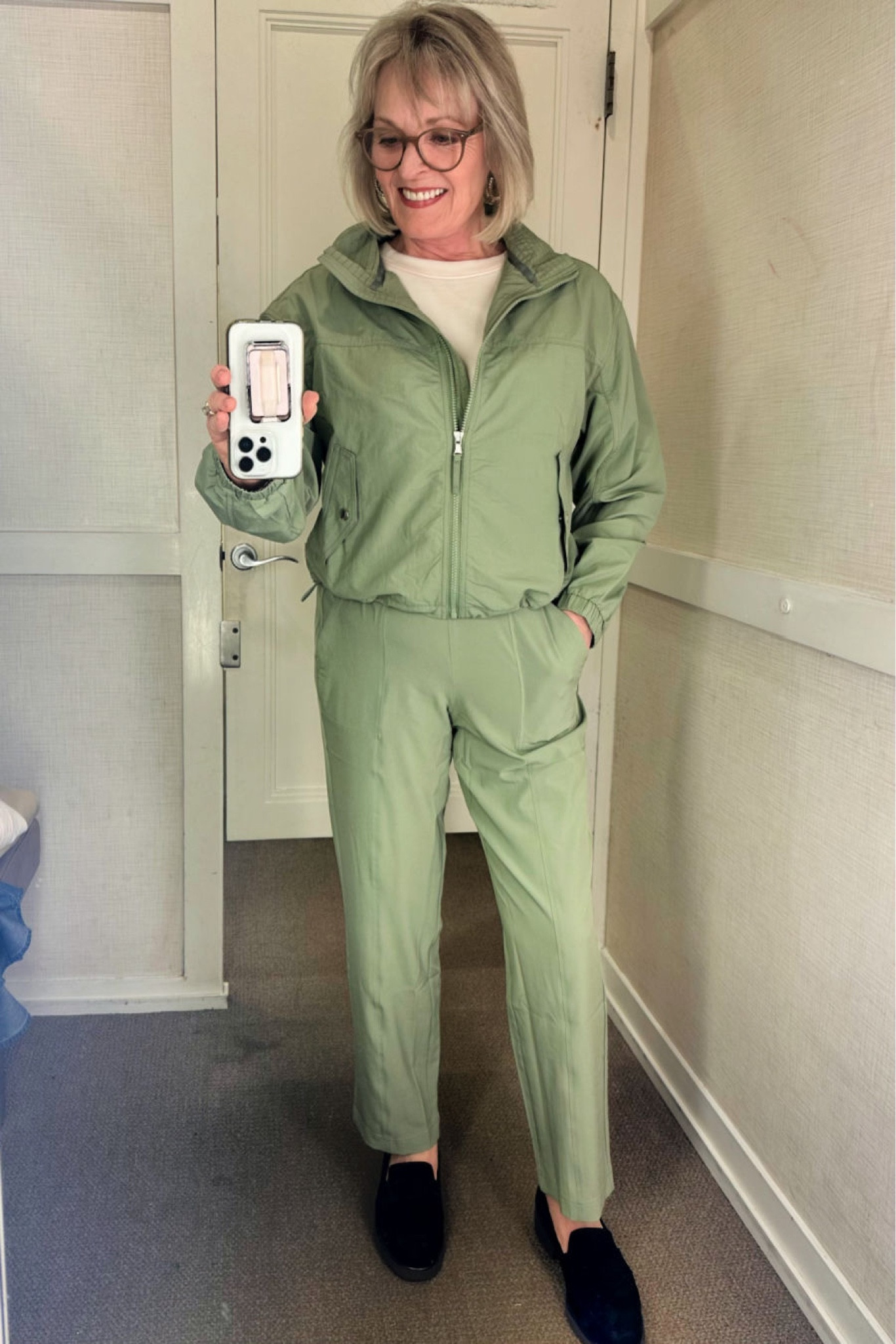 Loft calls the color of this great matching set "silver palm", but it's more of a pistachio shade to me. The windbreaker material is water-repellant with a bungee cord drawstring at the bottom. It also comes in a gorgeous bright hibiscus color. I love the elbow sleeve tee which I have on under the jacket. it also comes in the same silver palm shade as the jacket and pants. The pull-on pants come in 3 other colors, and the woven, wrinkle-resistant stretch fabric looks more polished than sweatpants and would be perfect for travel.

#fashion #fashionover50 #fashionover60 #springfashion #loft #loftfashion #lou&grey #matchingset #traveloutfit #matchingsetfortravel

#LTKstyletip #LTKfindsunder100 #LTKSeasonal