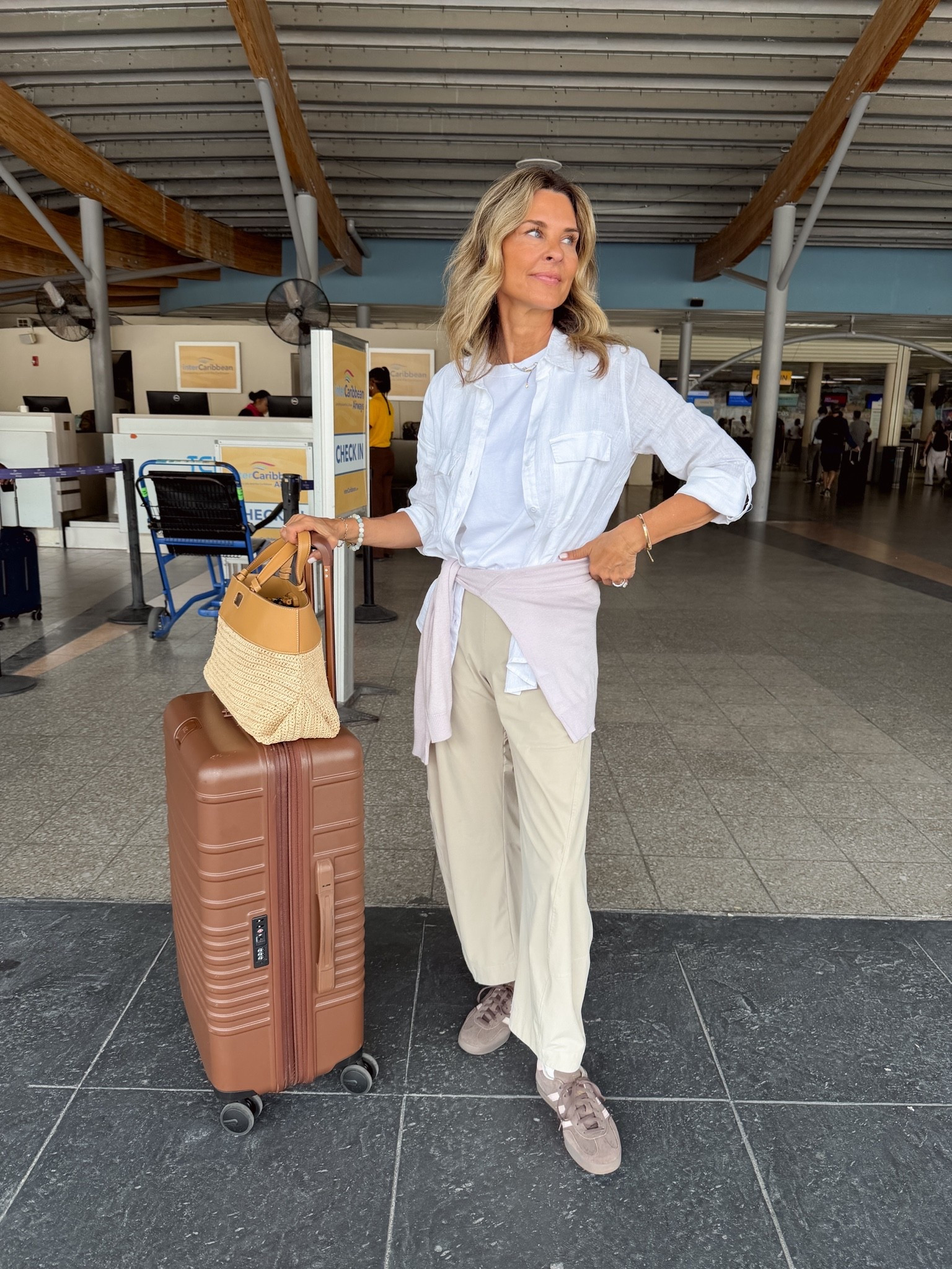 Travel look! I’m 5’6’’
-white tee size S
-utility linen button down size XS @Aritzia 
-pants are so comfy, TTS @Ruti 
-luggage is a must! @beistravel 
-bag is linked in my ShopMy https://go.shopmy.us/p-62918586

#LTKOver40 #LTKTravel #LTKfitnessgoals