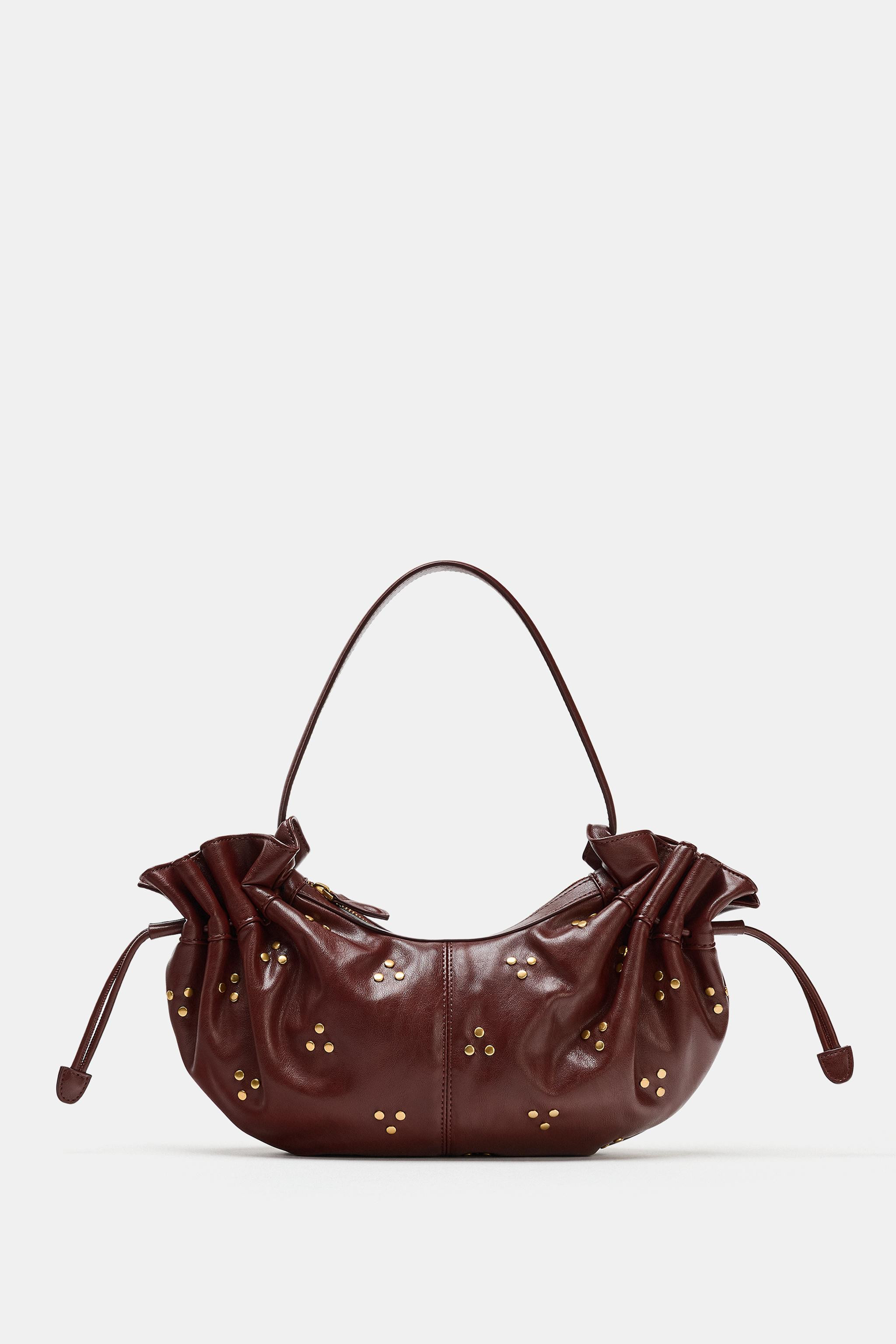 Shoulder bag. Featuring metallic stud detailing and gathered sides with adjustable drawstrings. Z... | Zara US