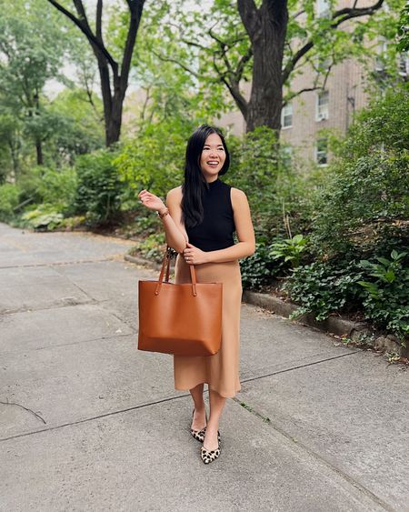 Business casual outfit, fall work outfit, transitional work outfit, Amazon fashion: Amazon finds: black sleeveless sweater (S), similar camel midi skirt, brown tote bag with zipper, similar leopard flats.

#LTKworkwear #LTKunder50 #LTKSeasonal