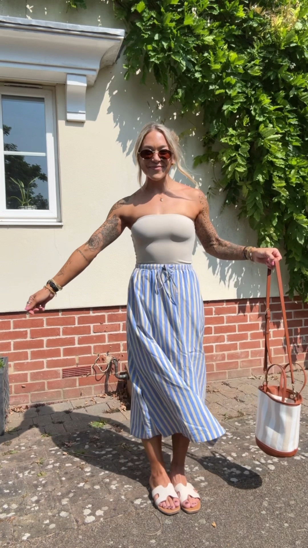 Ootd to visit Cambridge 🛶🌼🇬🇧 my fave Amazon tube top (S) / linen flowy skirt from Target (XS) & these sandals! I size up a 1/2 size 🤎 on sale! 

Summer style / target finds / Amazon / Holley Gabrielle / stripes / cute / casual / reel 

#LTKSaleAlert #LTKFindsUnder50 #LTKStyleTip