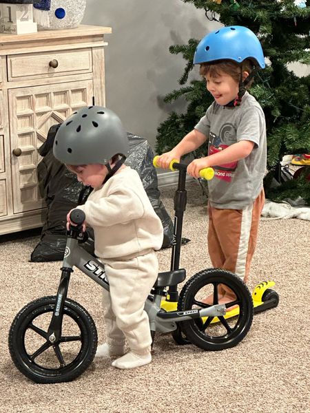 Toddler helmets, scooter, and bike! Now the real test, will they share 😅🫠 #toddlers 

#LTKfamily #LTKkids #LTKHoliday