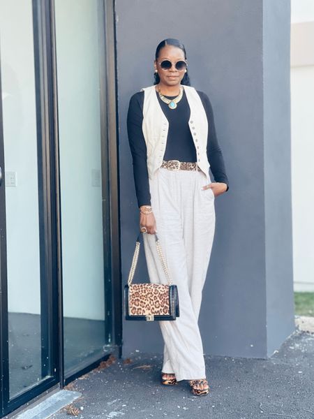 Linen Pants & Vest w/black bodysuit; leopard print platform heels and handbag 

#LTKstyletip