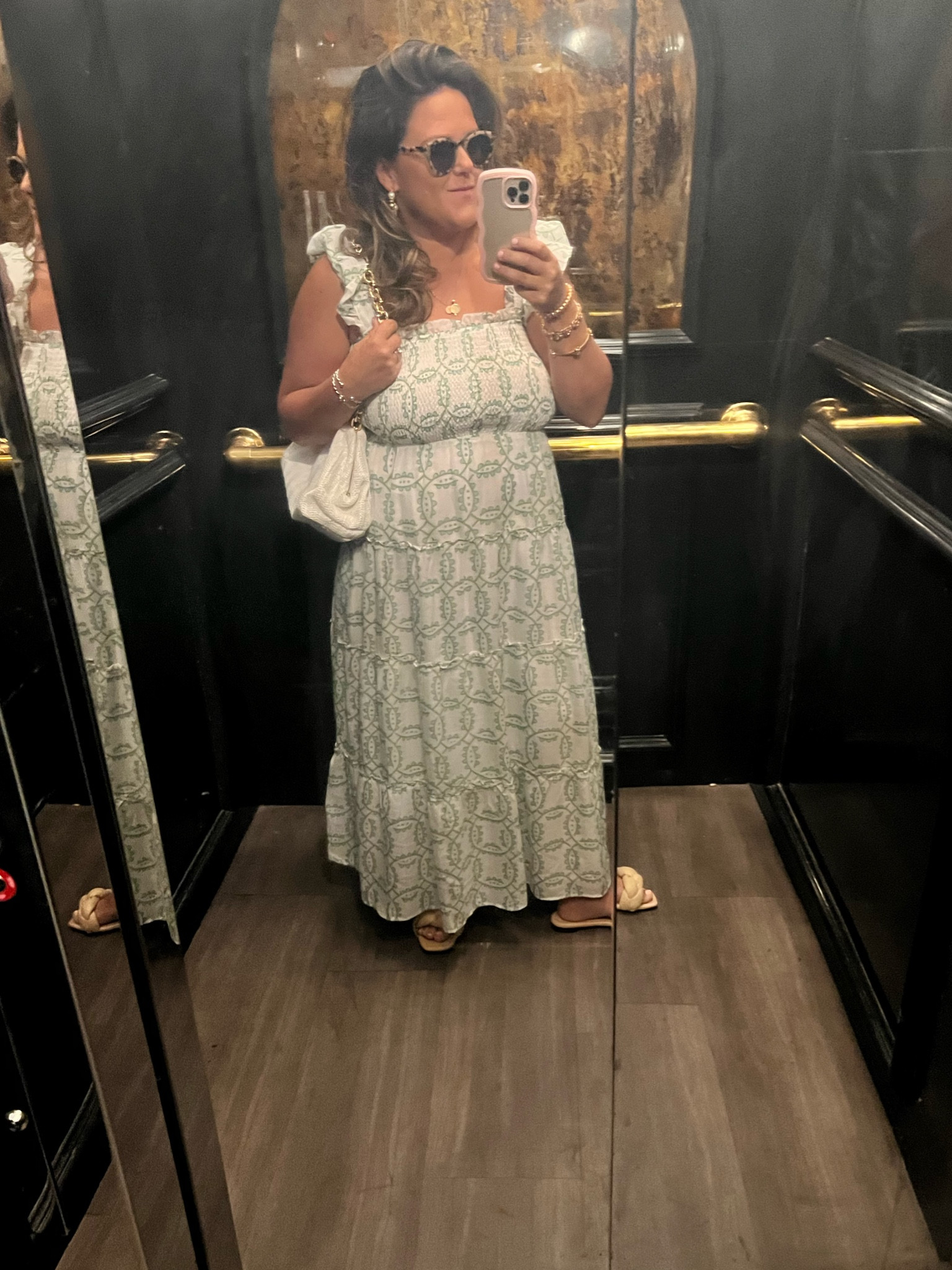 Green and white dress. White bag. Raffia sandals. 