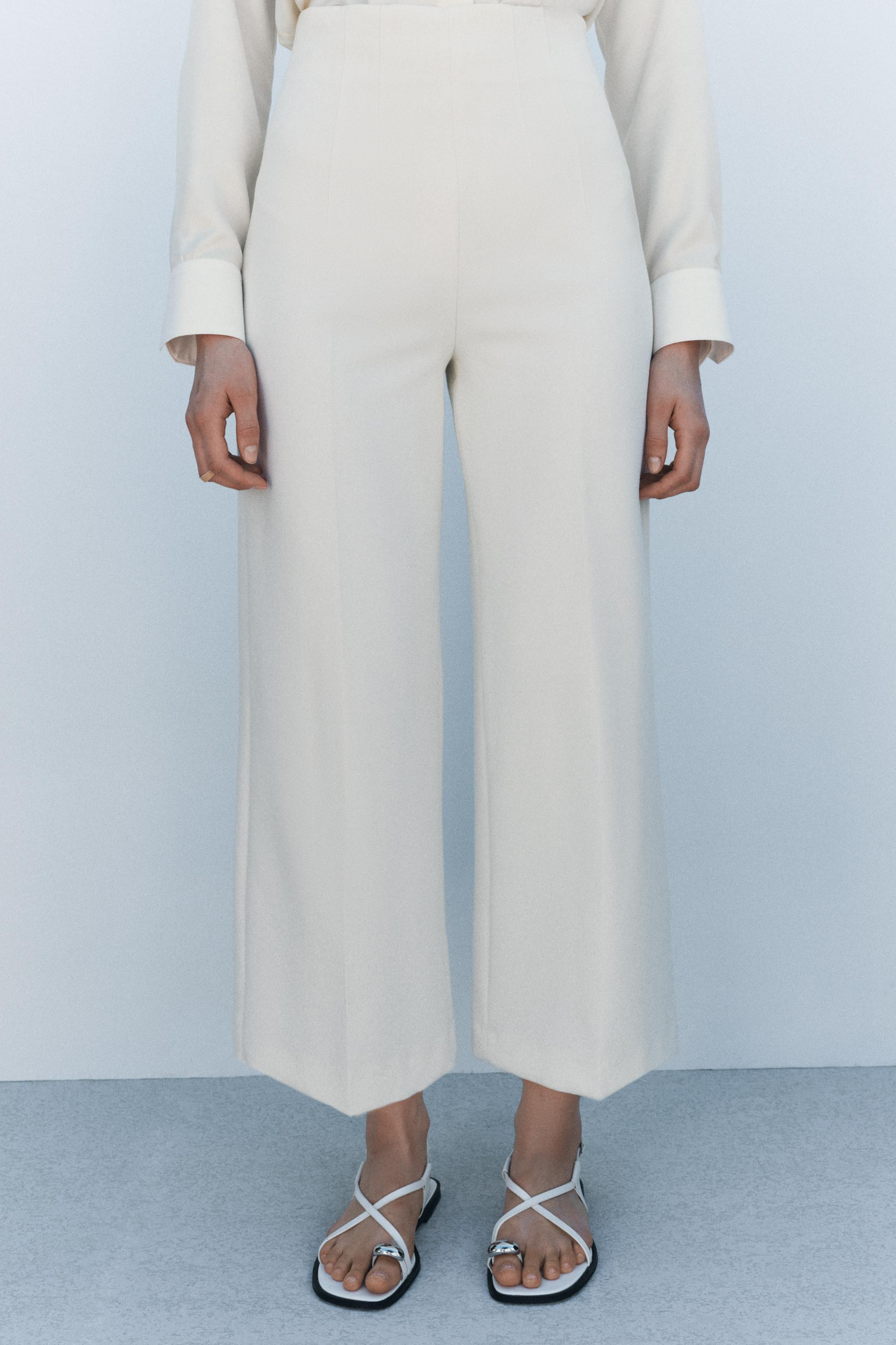 ZARA WOMAN COLLECTIONHigh-waisted, wide-leg pants. Front crease detail. Hidden in-seam side zippe... | Zara US