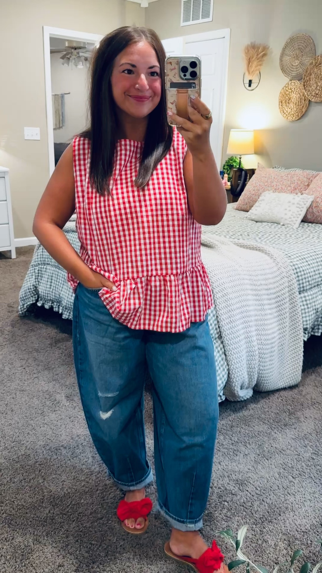 This red gingham top is such a fun classroom find! ❤️ The peplum detail is darling paired with relaxed jeans, and the bow sandals add the cutest pop of red. An easy school counselor outfit for now and game days this fall with a denim jacket or cardigan!

sandals: fit true to size // wearing a 5
jeans: fit oversized // wearing a 12
tank: fits oversized // wearing a large 

 #LTKMidsize #LTKWorkwear