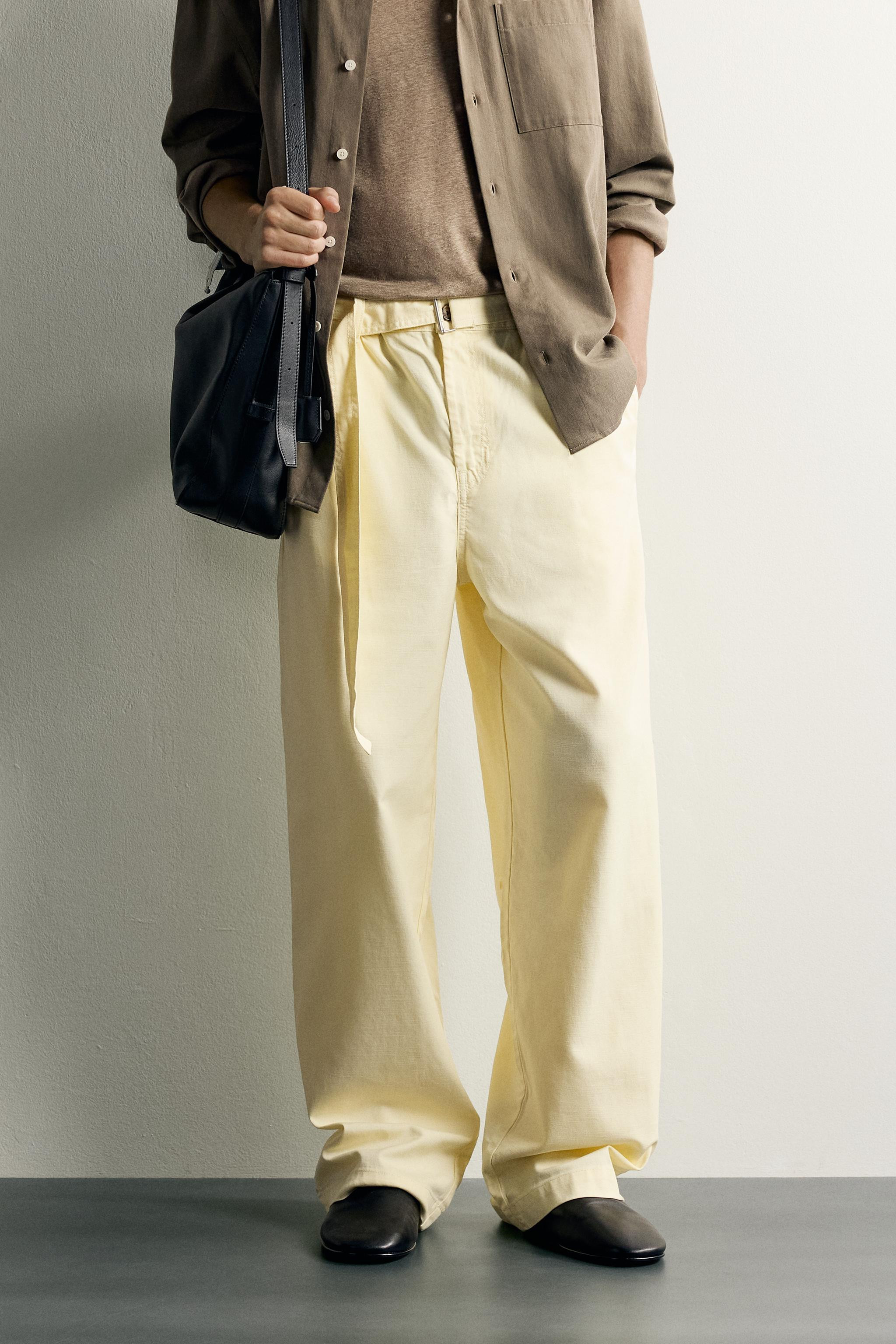Relaxed fit pants made of a fluid lyocell and cotton blend fabric. Elastic waist with an adjustab... | Zara US