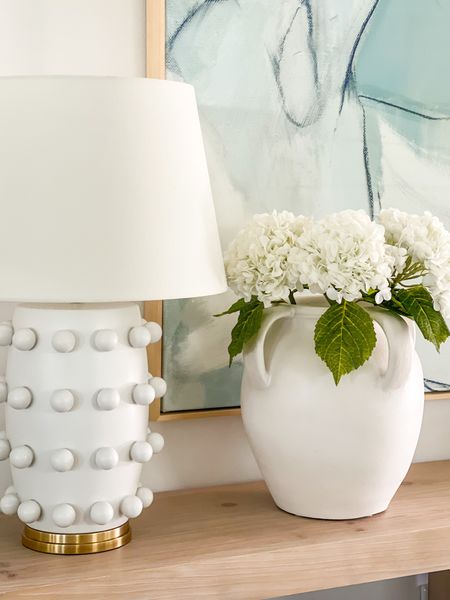 Seriously in love with these real-touch faux hydrangeas! I need to order another set for this large white ceramic vase, but they’re perfect for spring and summer decor (and come in several colors)! Also linking our long console table, abstract art and circle dot lamp!
.
#ltkhome #ltkseasonal #ltksalealert #ltkunder50 #ltkunder100 #ltkstyletip Amazon decor, favorite vase, designer lamp

#LTKhome #LTKunder50 #LTKSeasonal