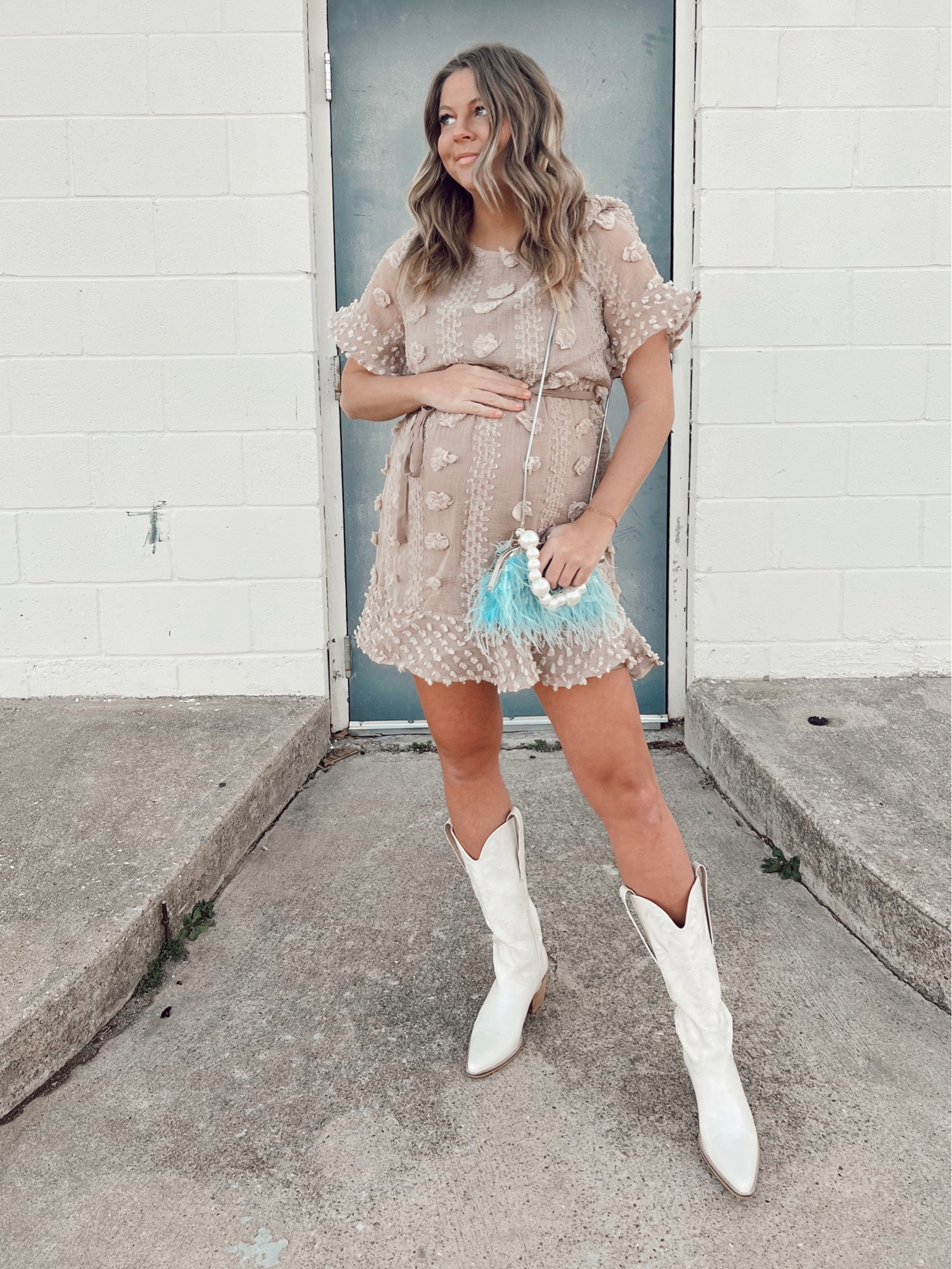 Polka dot textured dress, paired with cowboy boots and feather purse 

#LTKunder100 #LTKstyletip #LTKbump