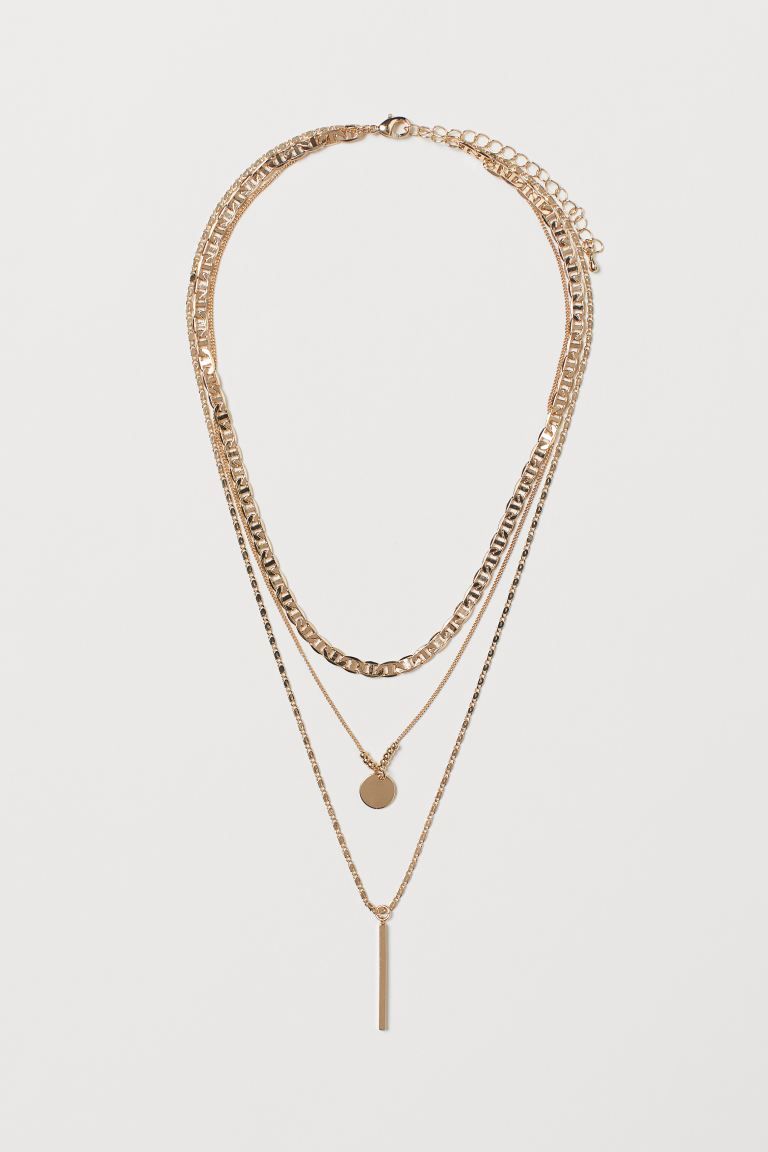 Necklace with three narrow metal chains in various designs. One chain decorated with a round pend... | H&M (US + CA)
