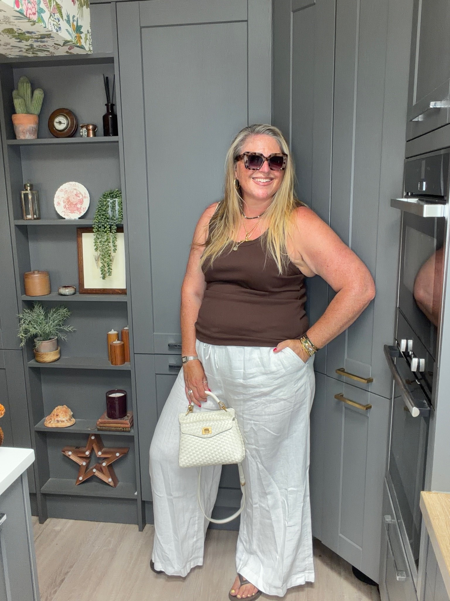 White line palazzo trousers, brown vest, flip flops, white bag sunglasses

#LTKsummer #LTKplussize #LTKstyletip