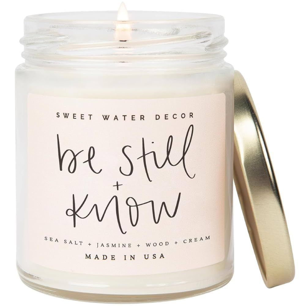 Sweet Water Decor, Be Still and Know, Sea Salt, Jasmine, Cream, and Wood Scented Soy Wax Candle f... | Amazon (US)