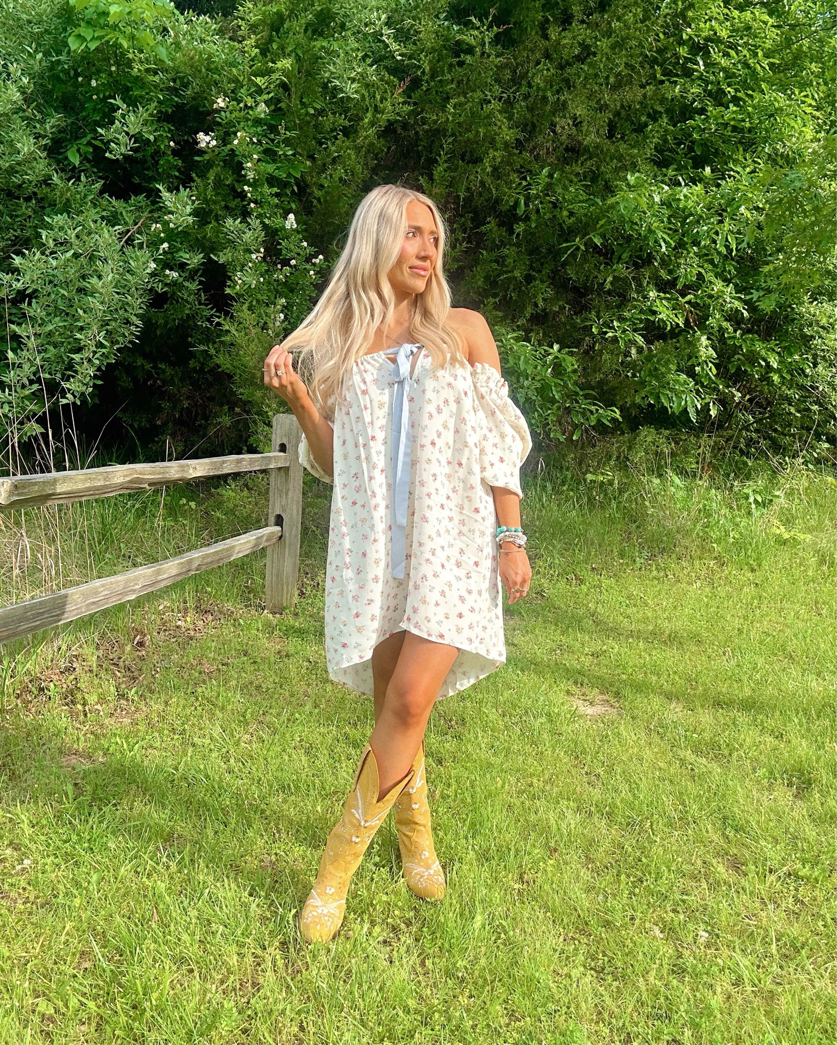 Country girl summer in full swing 🤠🌸 Nothing beats a breezy floral dress and the perfect pair of embroidered boots for those golden hour strolls

🛍️ Outfit Details:
	•	Off-the-shoulder floral mini dress – light, flowy, and flirty
	•	Embroidered mustard cowgirl boots – the statement piece
	•	Natural makeup & soft waves for that effortless vibe

boho, western, feminine, summery, romantic, flirty, soft glam, nature-inspired, golden hour glow, wildflower vibes
#LTKSpringStyle #LTKWestern #LTKBoho #CowgirlStyle #BohoOutfit #WesternFashion #SummerOOTD #CountryStyle #FloralDress #OffTheShoulderDress #EmbroideredBoots #BlondeAndBoho #OutfitInspo #BreezyStyle


#LTKSeasonal #LTKPetite #LTKStyleTip